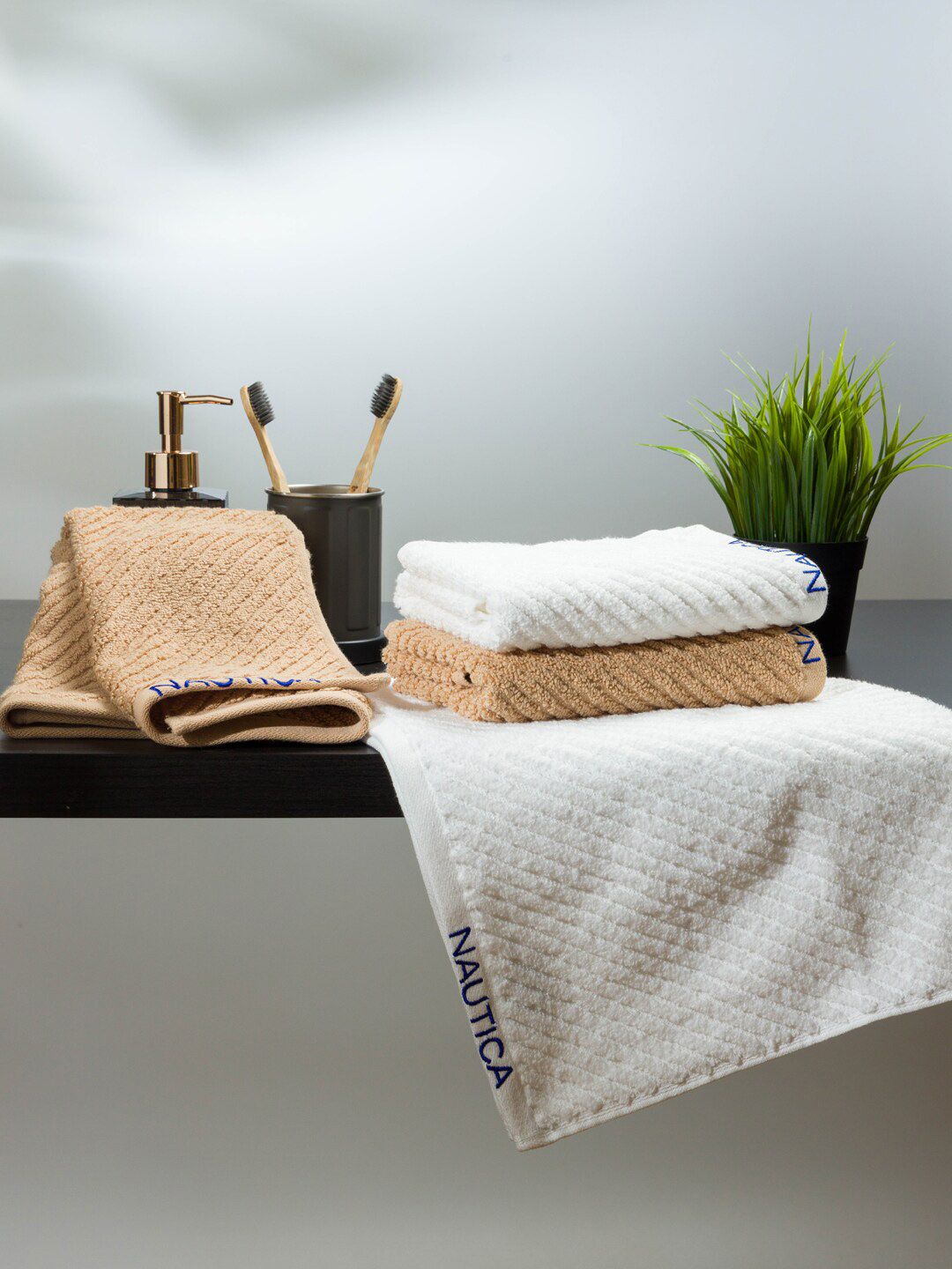 Nautica Set Of 4 White & Camel brown Solid 600 GSM Pure Cotton Hand Towels Price in India