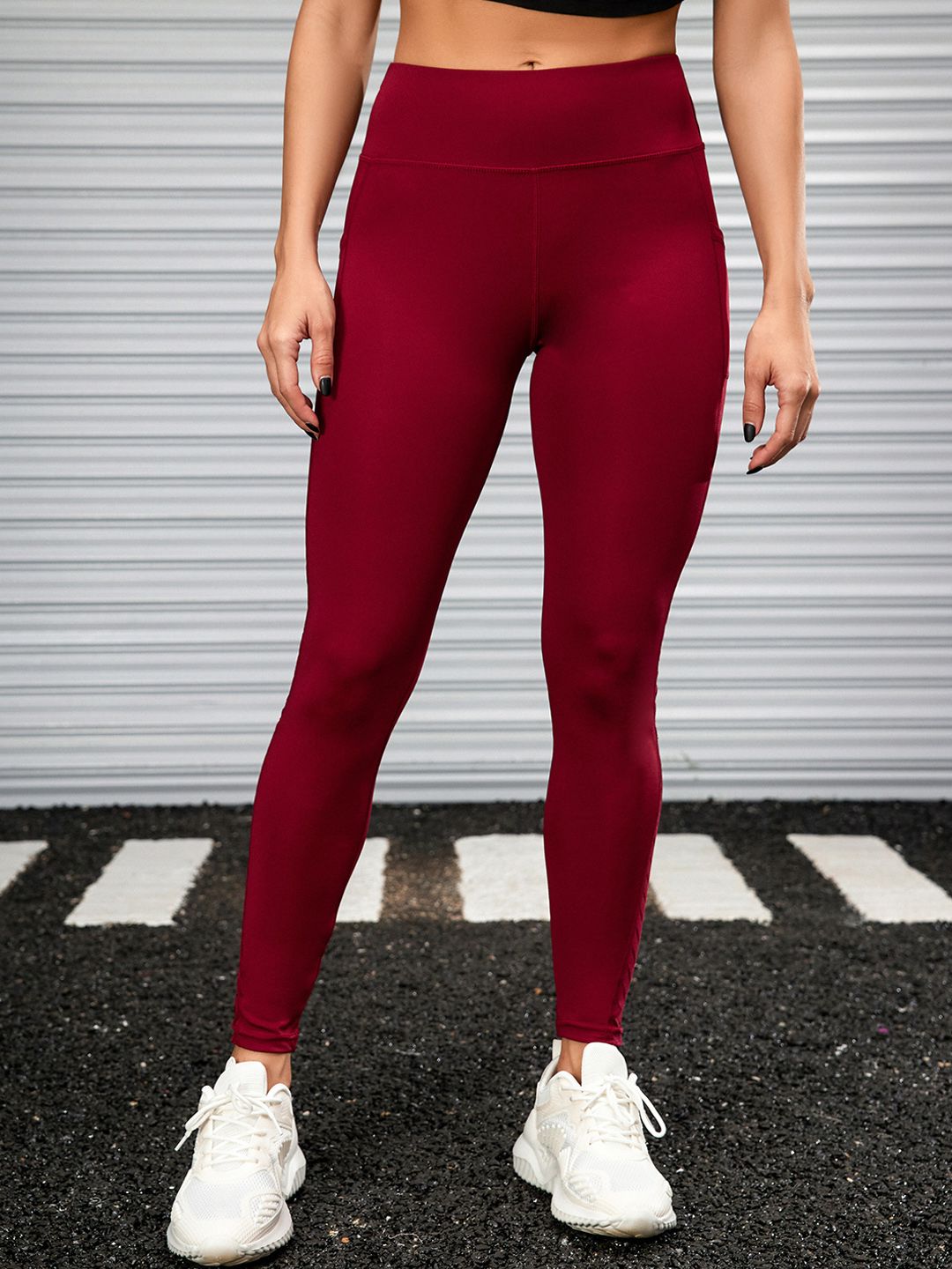 URBANIC Women Burgundy Solid Gym Tights Price in India