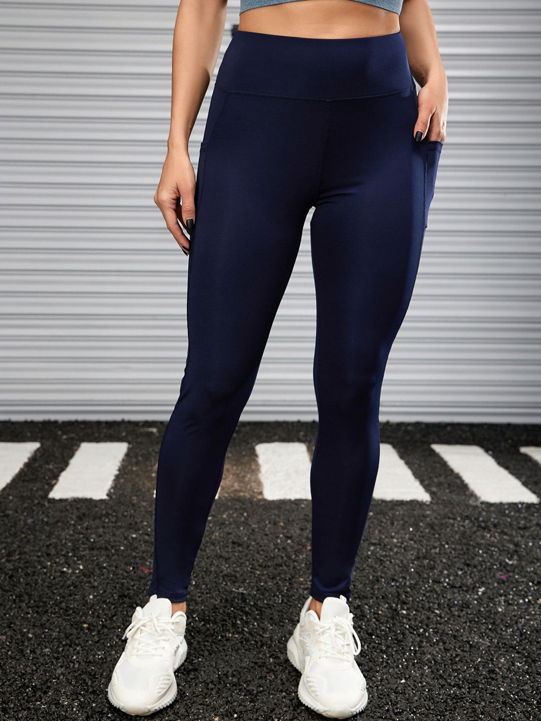 URBANIC Women Navy Blue Solid Ankle Length Gym Tights Price in India