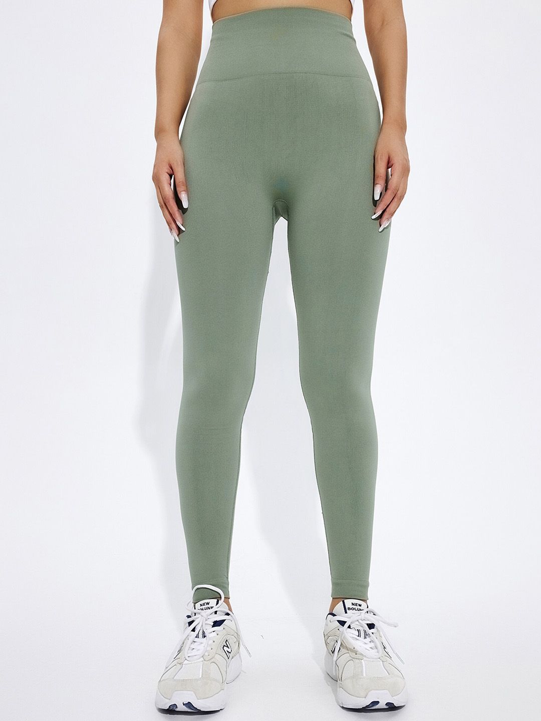 URBANIC Women Olive Green Solid Gym Tights Price in India