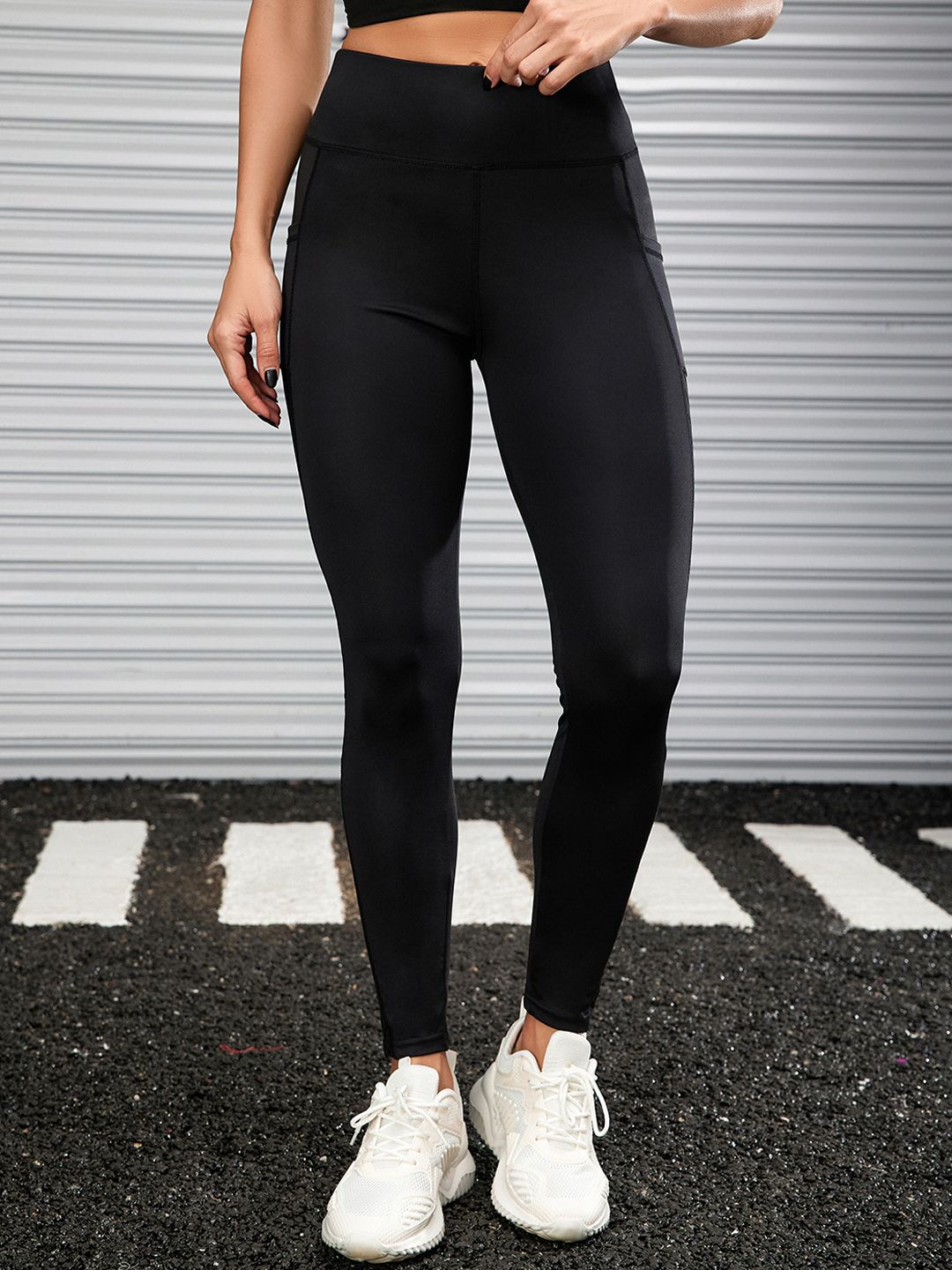 URBANIC Women Black Solid Training & Gym Tights Price in India