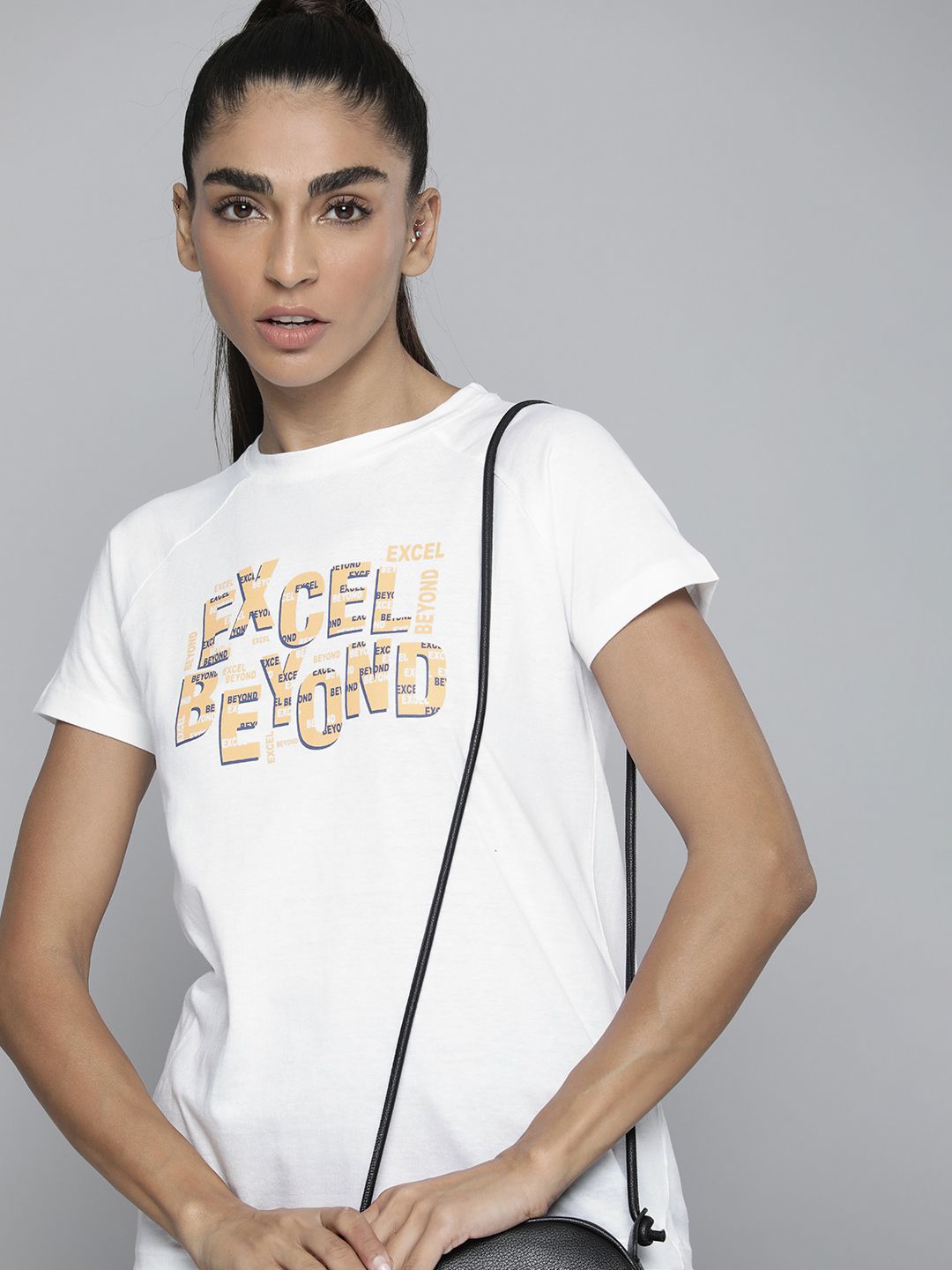 HRX by Hrithik Roshan Women White & Beige Pure Cotton Typography Printed T-shirt Price in India