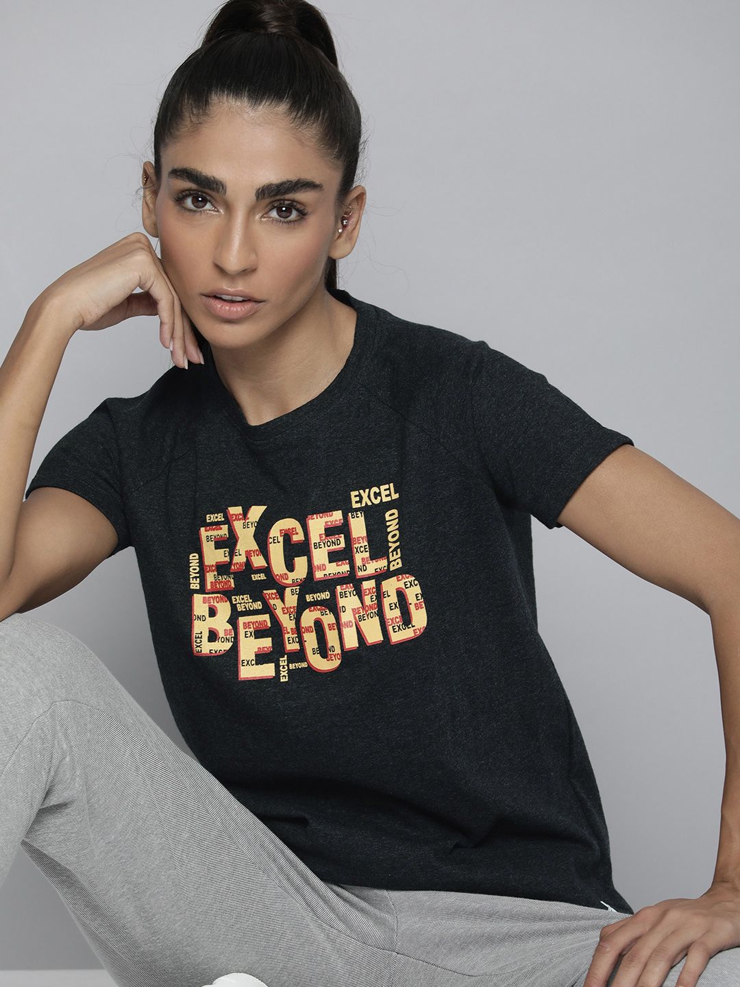 HRX by Hrithik Roshan Women Charcoal Black & Yellow Typography Printed T-shirt Price in India