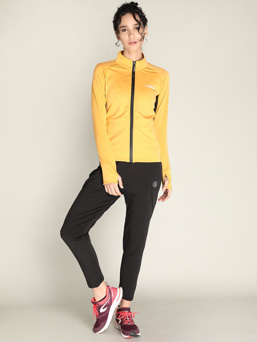 CHKOKKO Women Mustard & Black Solid Tracksuits Price in India