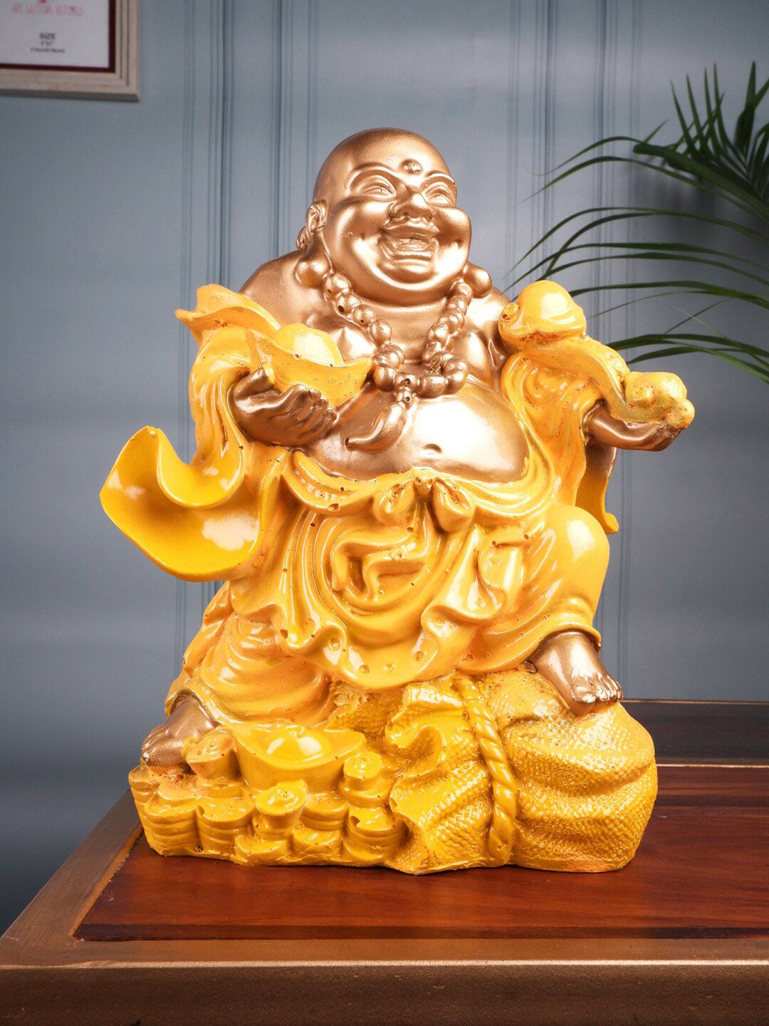 THE WHITE INK DECOR Yellow Fengshui Laughing Buddha Figurine Showpieces Price in India