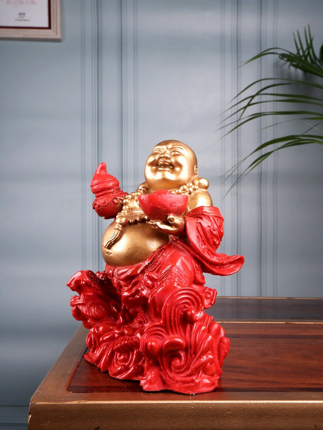 THE WHITE INK DECOR Gold-Toned & Red Fengshui Laughing Buddha Figurine Showpieces Price in India