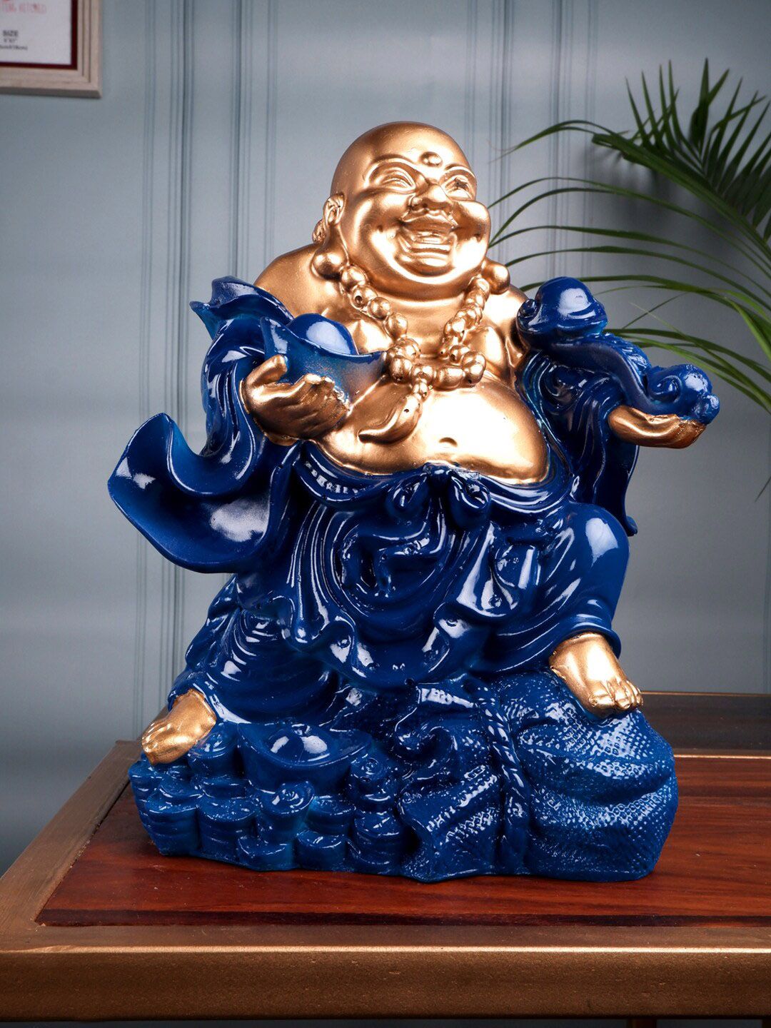 THE WHITE INK DECOR Blue & Gold Fengshui Laughing Buddha Showpieces Price in India