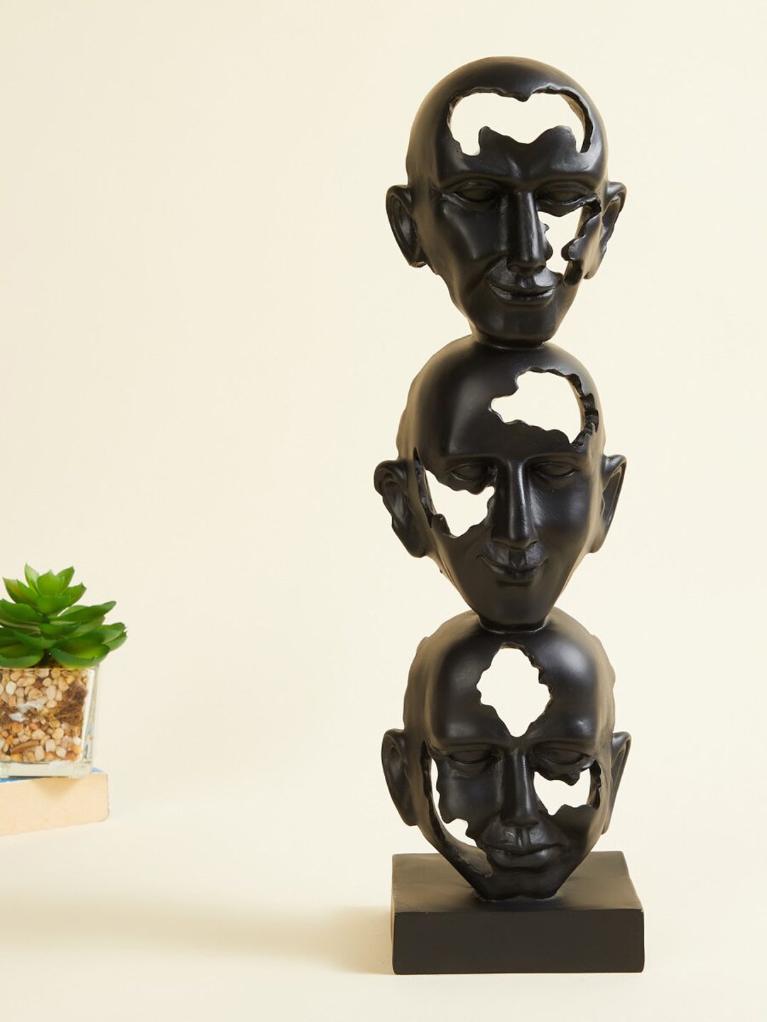 Home Centre Black Textured Polyresin Juxtaposed Faces Figurine Showpieces Price in India