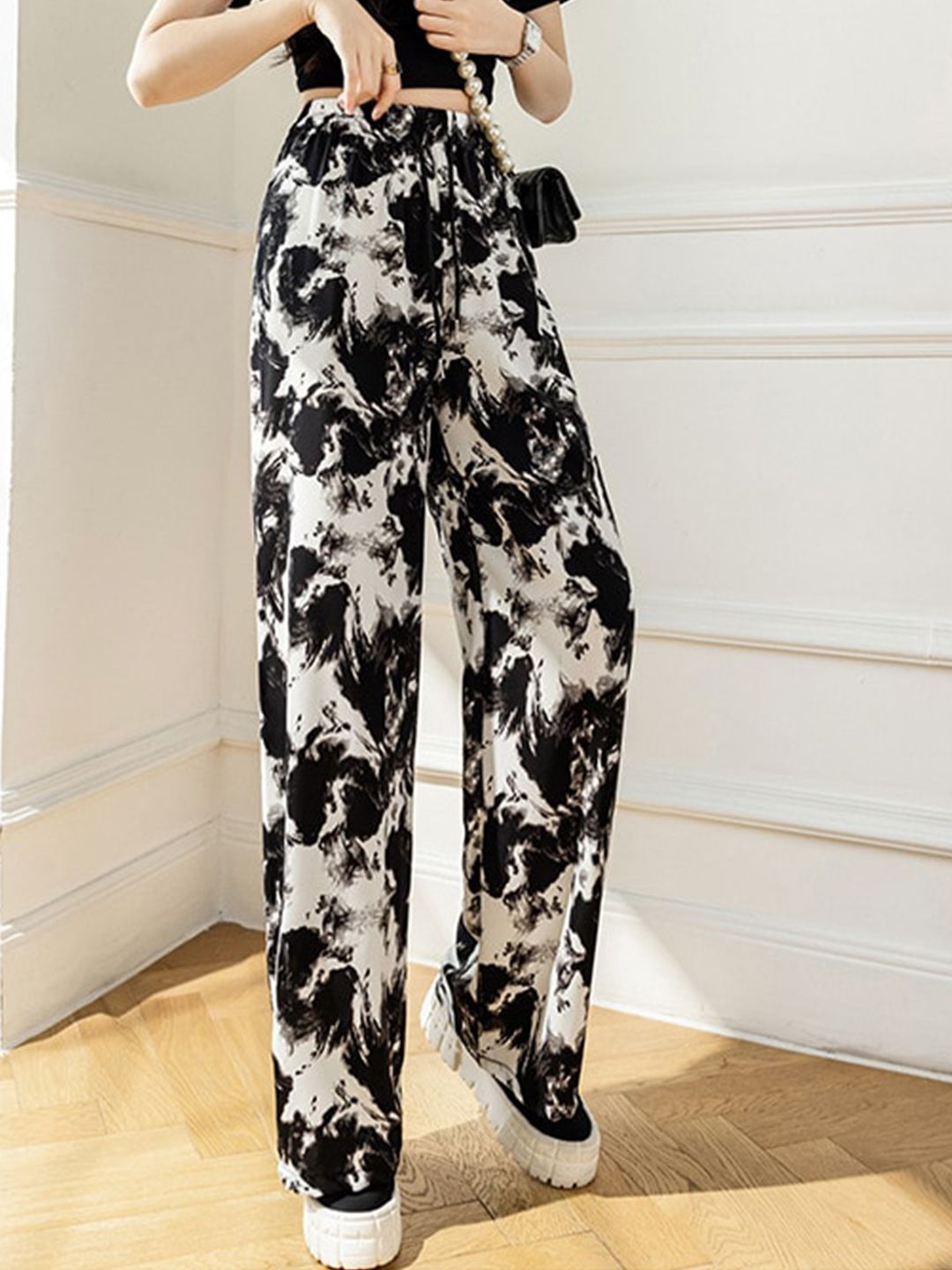 La Aimee Women Black Printed Loose Fit Trousers Price in India