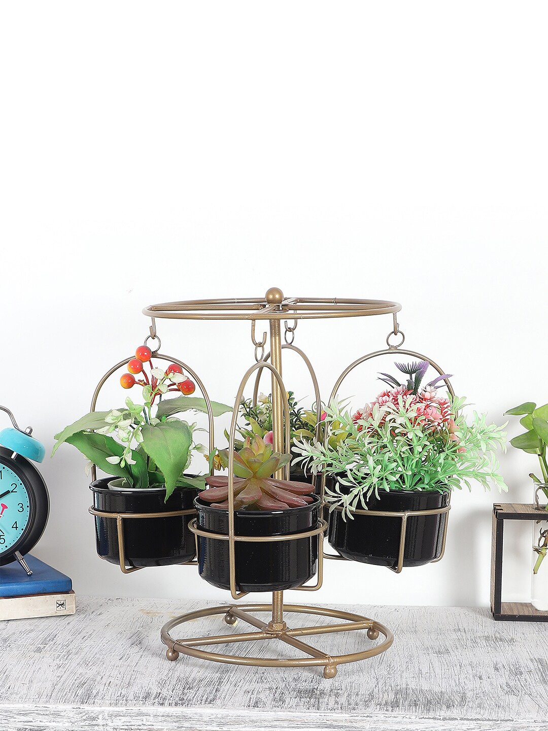 Amaya Decors Set Of 4 Gold-Toned & Black Solid Revolving Merry Go Round Planters With Stand Price in India
