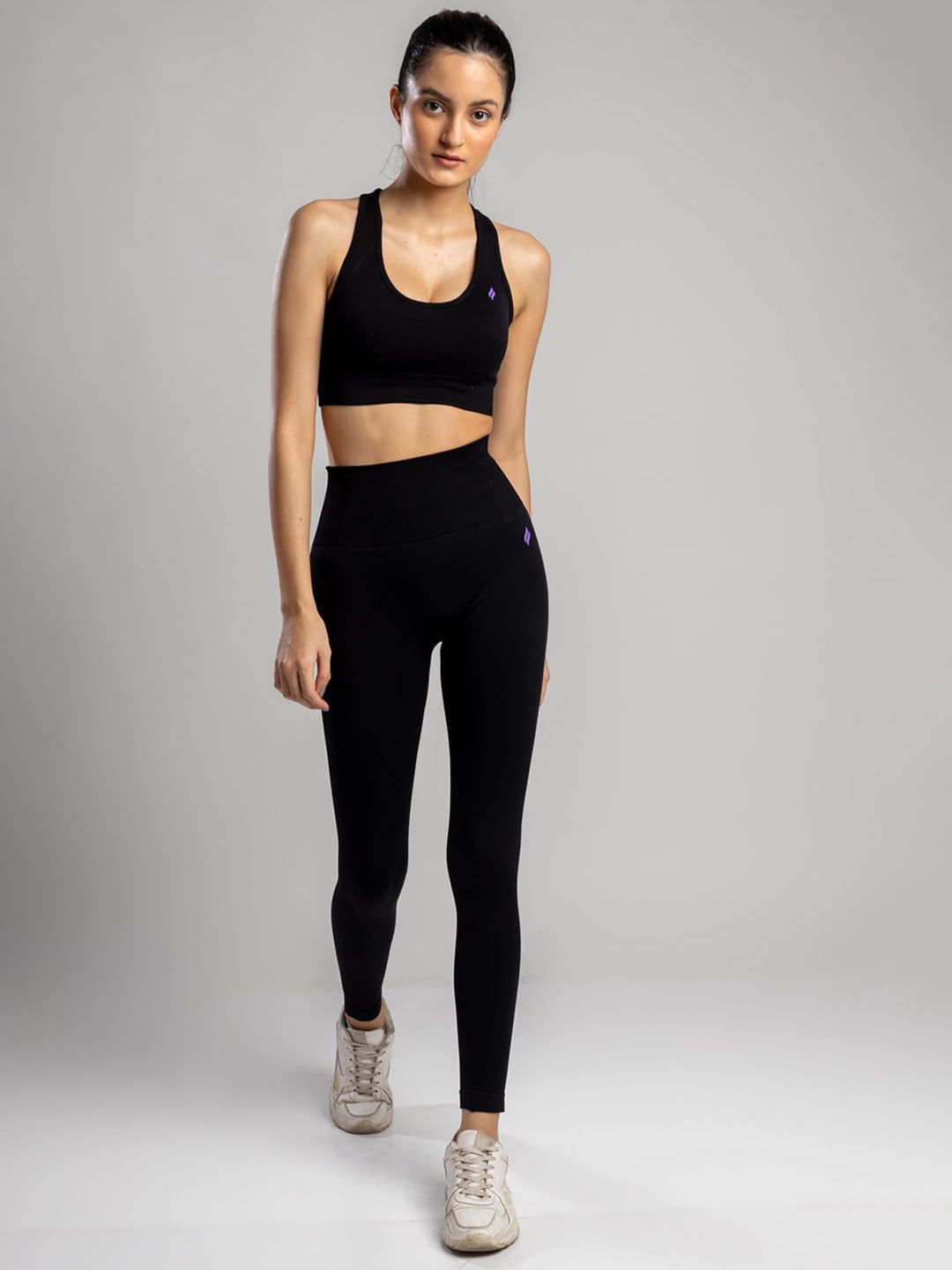 SKNZ Women Black Solid Tracksuits Price in India
