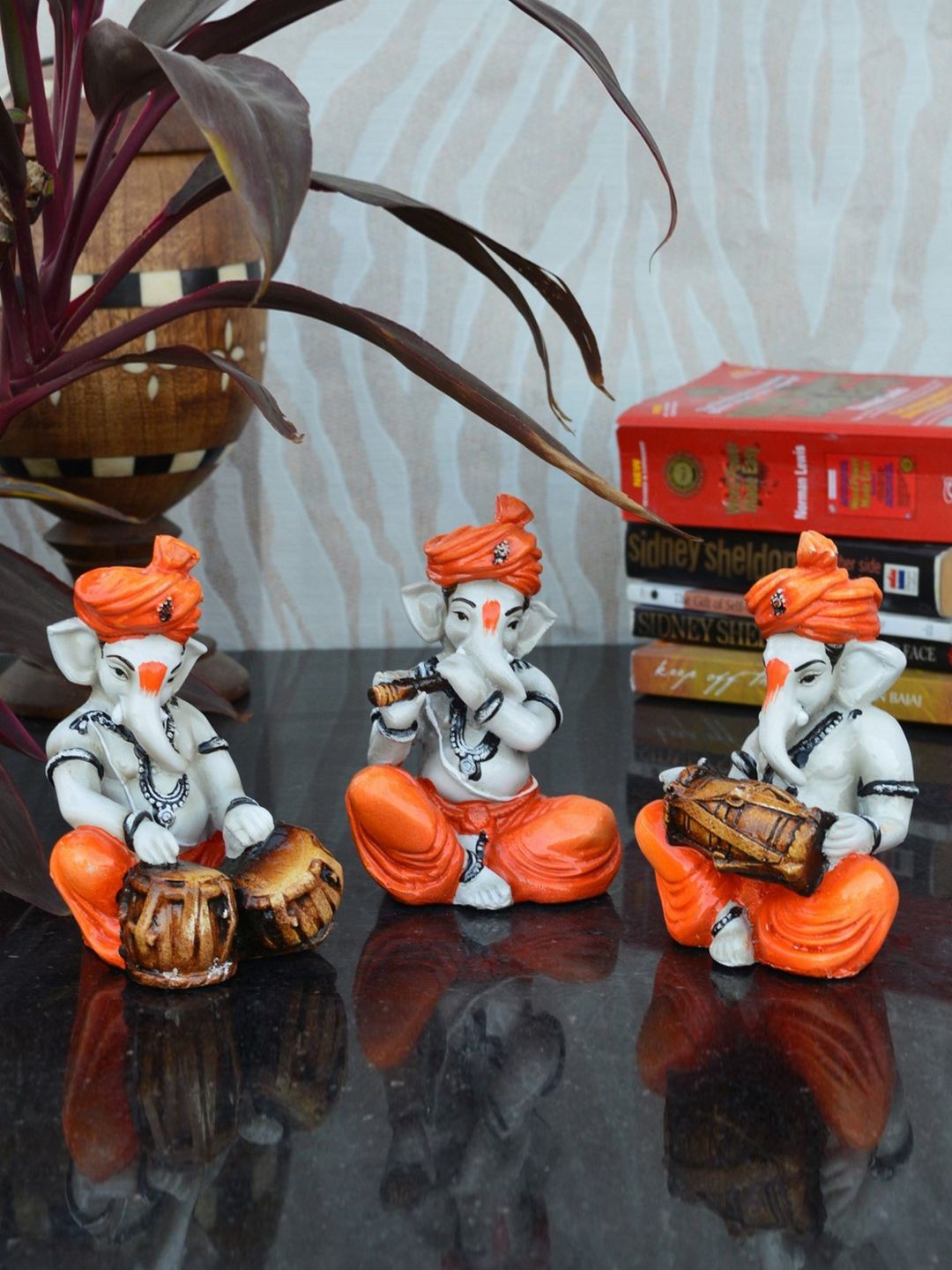 eCraftIndia Set of 3 Orange Handcrafted Polyresin Lord Ganesha-Shaped Showpieces Price in India