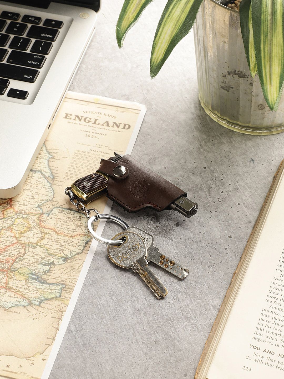 EXIM DECOR Brown Solid Metal Gun Keychain With Leather Cover Price in India