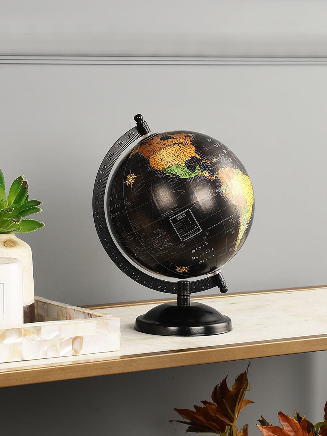 EXIM DECOR Black & Yellow Printed Globe Showpieces Price in India