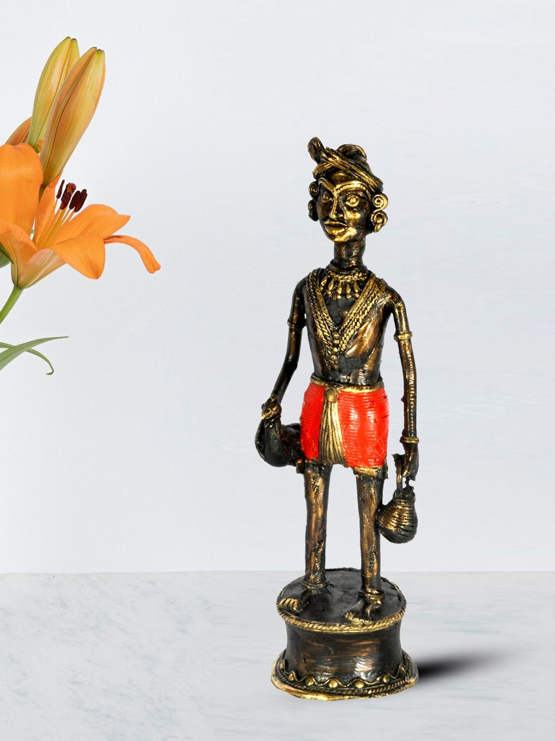 SHREE KALA HOME DECOR Bronze-Toned & Red Textured Tribal Man With Chicken Showpieces Price in India