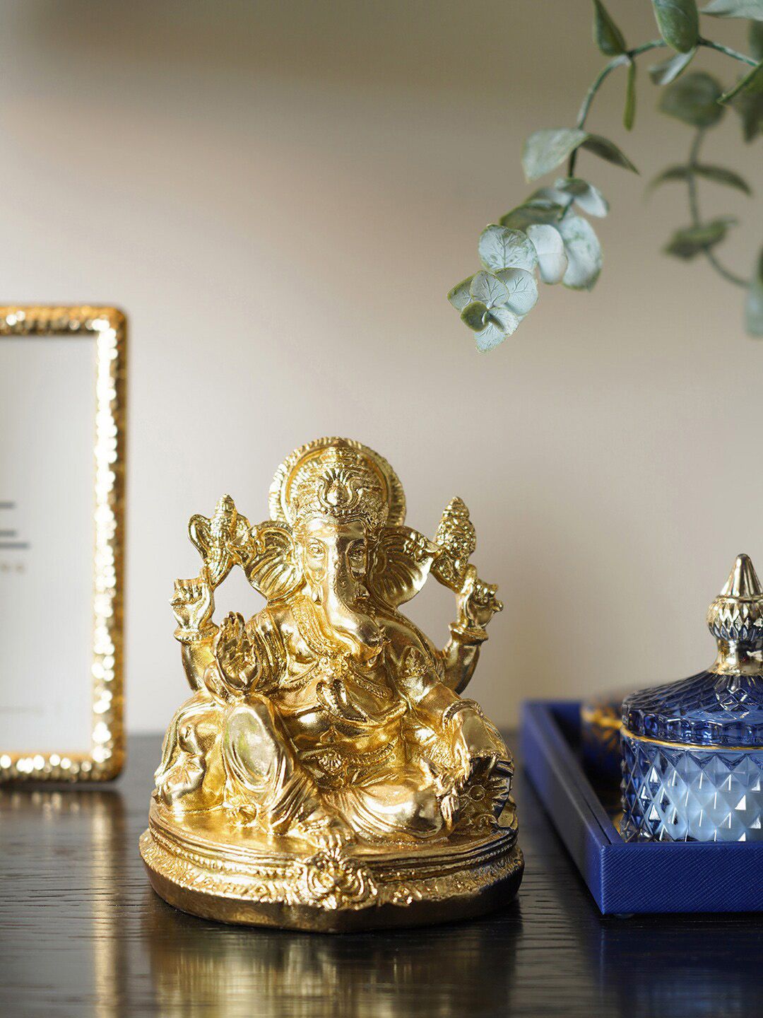 Pure Home and Living Gold-Toned Sitting Ganesha Showpiece Price in India