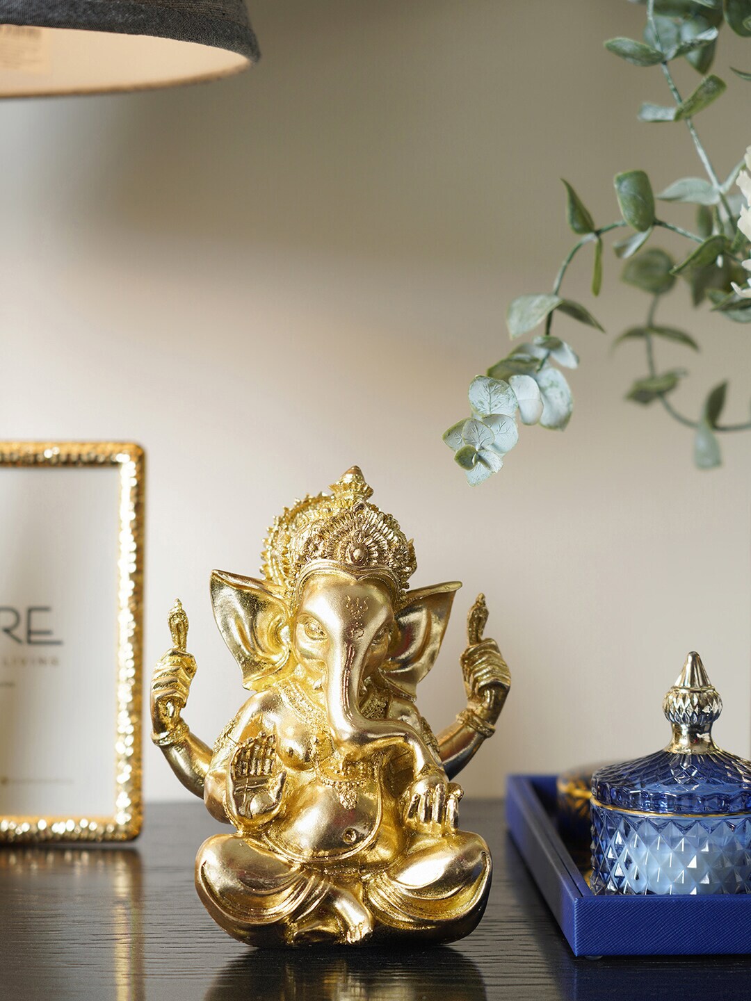 Pure Home and Living Gold Toned Solid Lord Ganesha Ceramic Showpiece Price in India