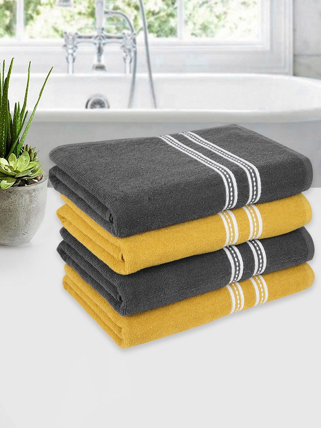 ROMEE Set Of 4 Yellow & Grey Solid 500 GSM Cotton Bath Towels Price in India