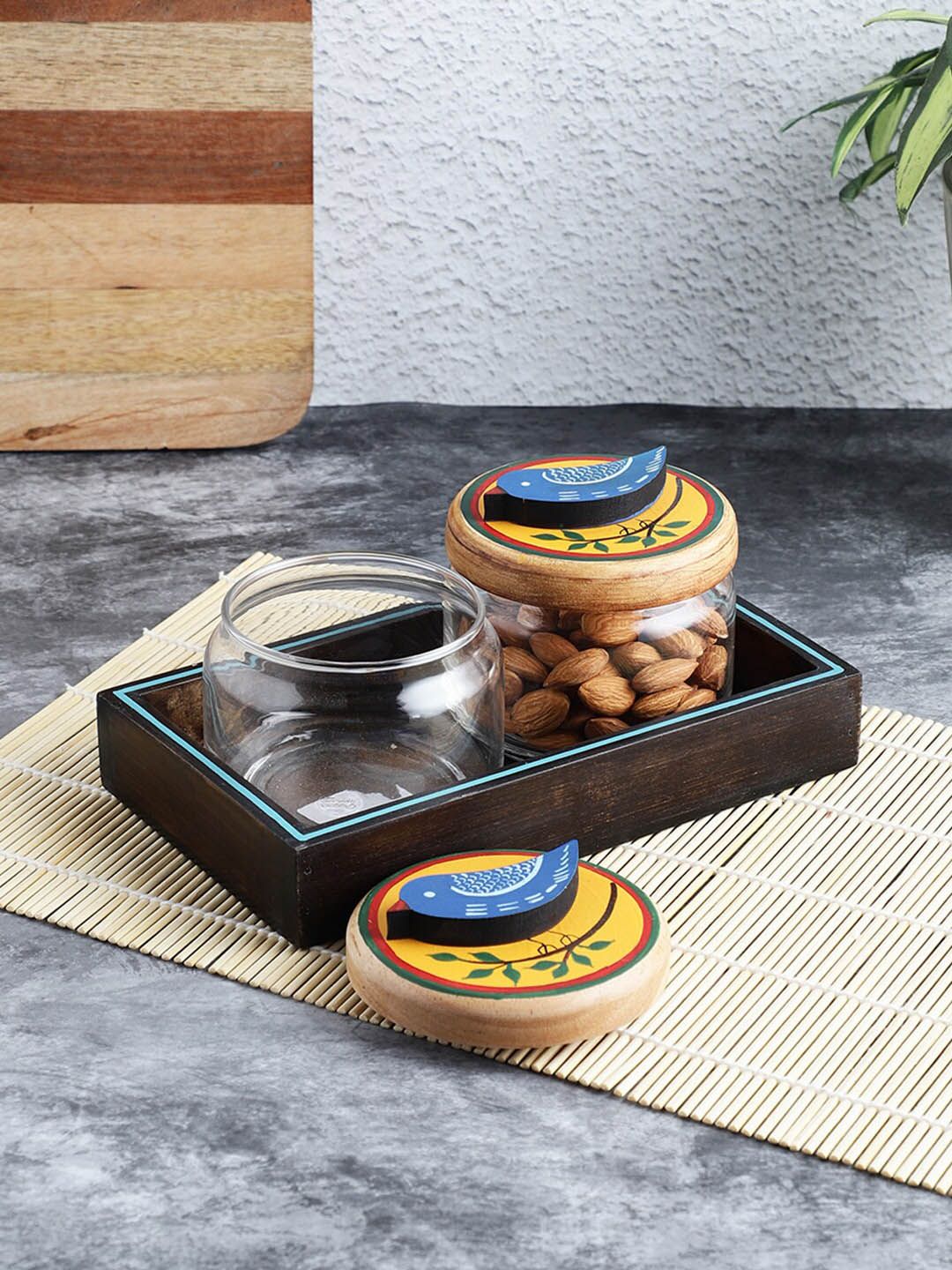 VarEesha Set of 2 Transparent & Mustard Yellow Printed Glass Jars with Wooden Tray Price in India