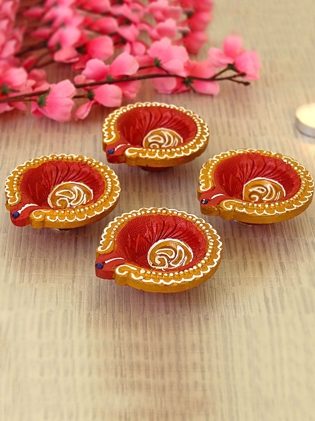 TIED RIBBONS Set Of 4 Terracotta Diyas Price in India