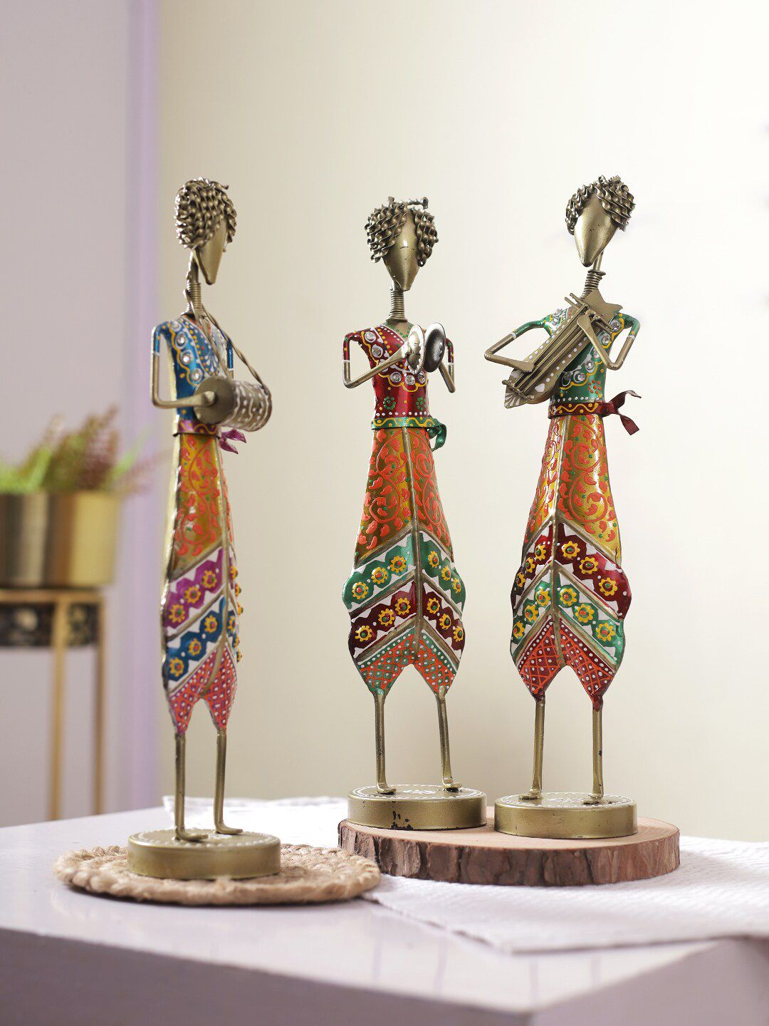 Aapno Rajasthan Set Of 3 Gold-Toned & Orange Solid Traditional Colorful Musical Showpiece Price in India