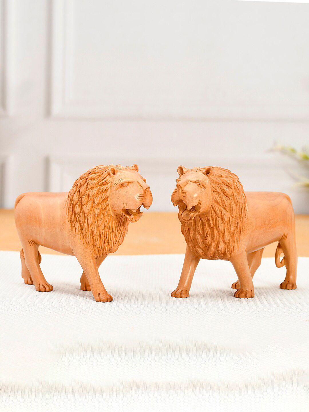 RDK Set Of 2 Beige Solid Lion Eye Catching Showpieces Price in India