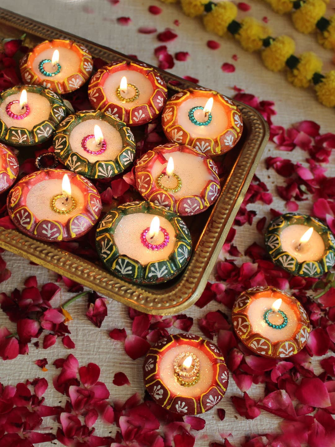 TIED RIBBONS Set of 12 Multicoloured Terracotta Clay Wax Filled Diya Candles Price in India