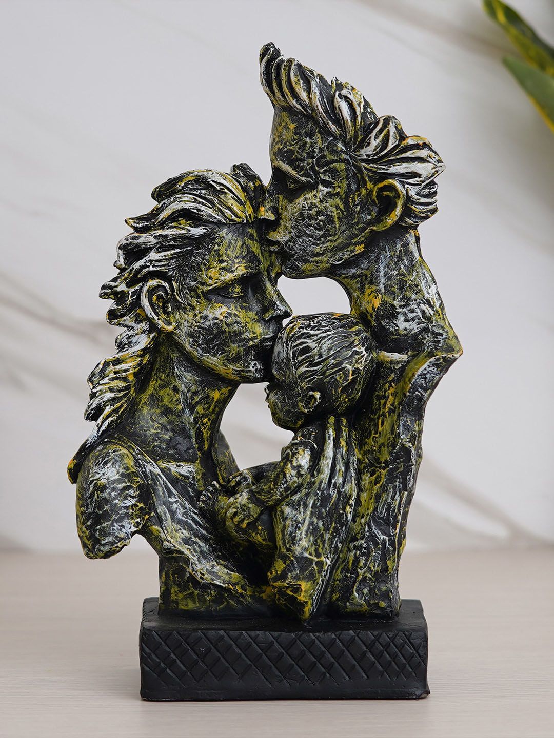 eCraftIndia Silver-Toned & Green Textured Man Kissing Woman Kissing A Child Figurine Showpiece Price in India