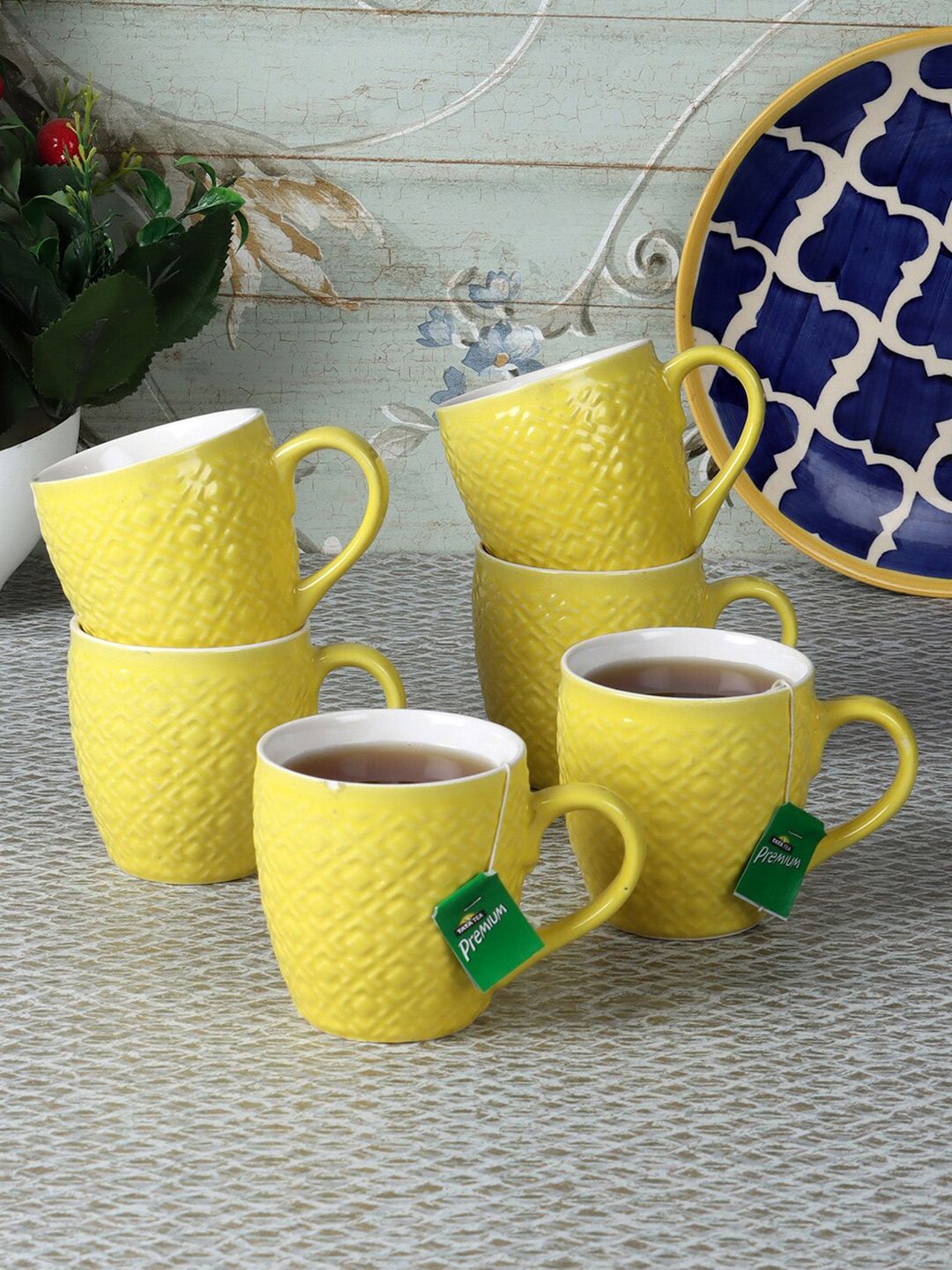 CDI Yellow & White Textured Ceramic Glossy Cups Set of 7 With Wooden Tray Price in India