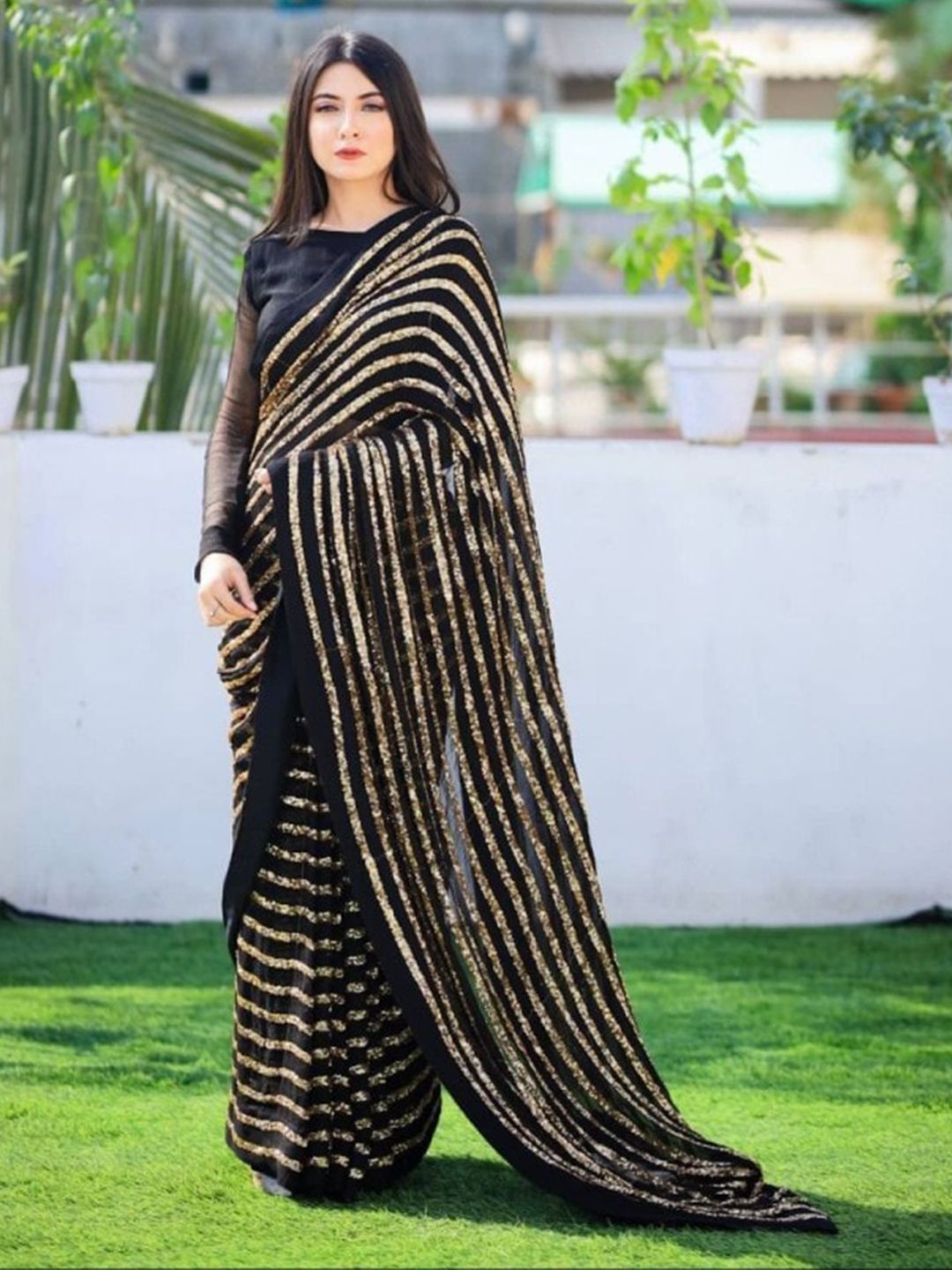 CLOMITA Black & Golden Striped Sequinned Georgette Saree Price in India