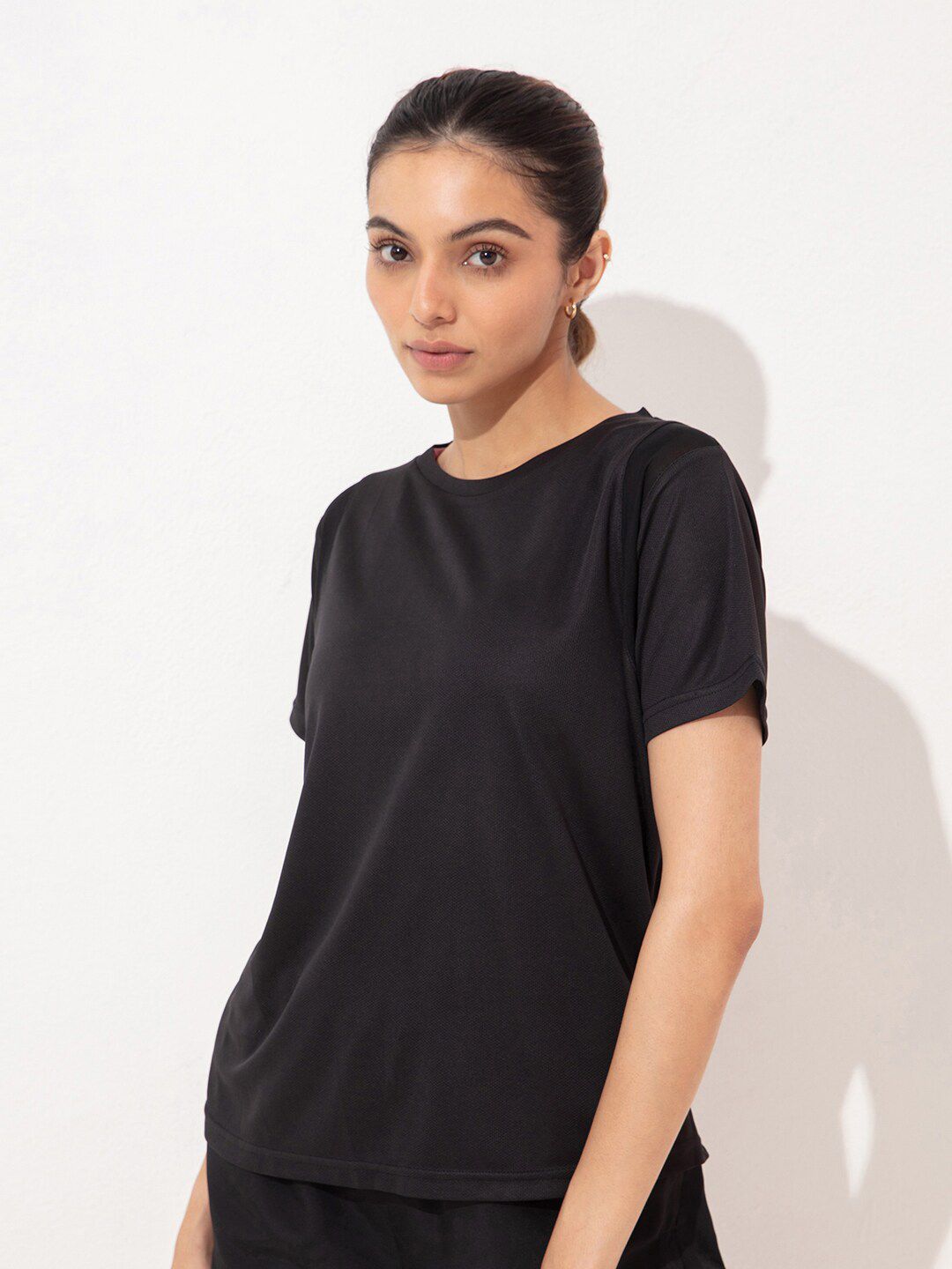 KICA Women Black Solid Sport T-shirt Price in India