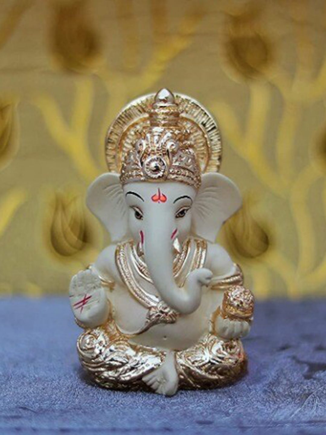Perpetual Cream-Colored & Gold-Toned Ganesha Idol Showpiece Price in India
