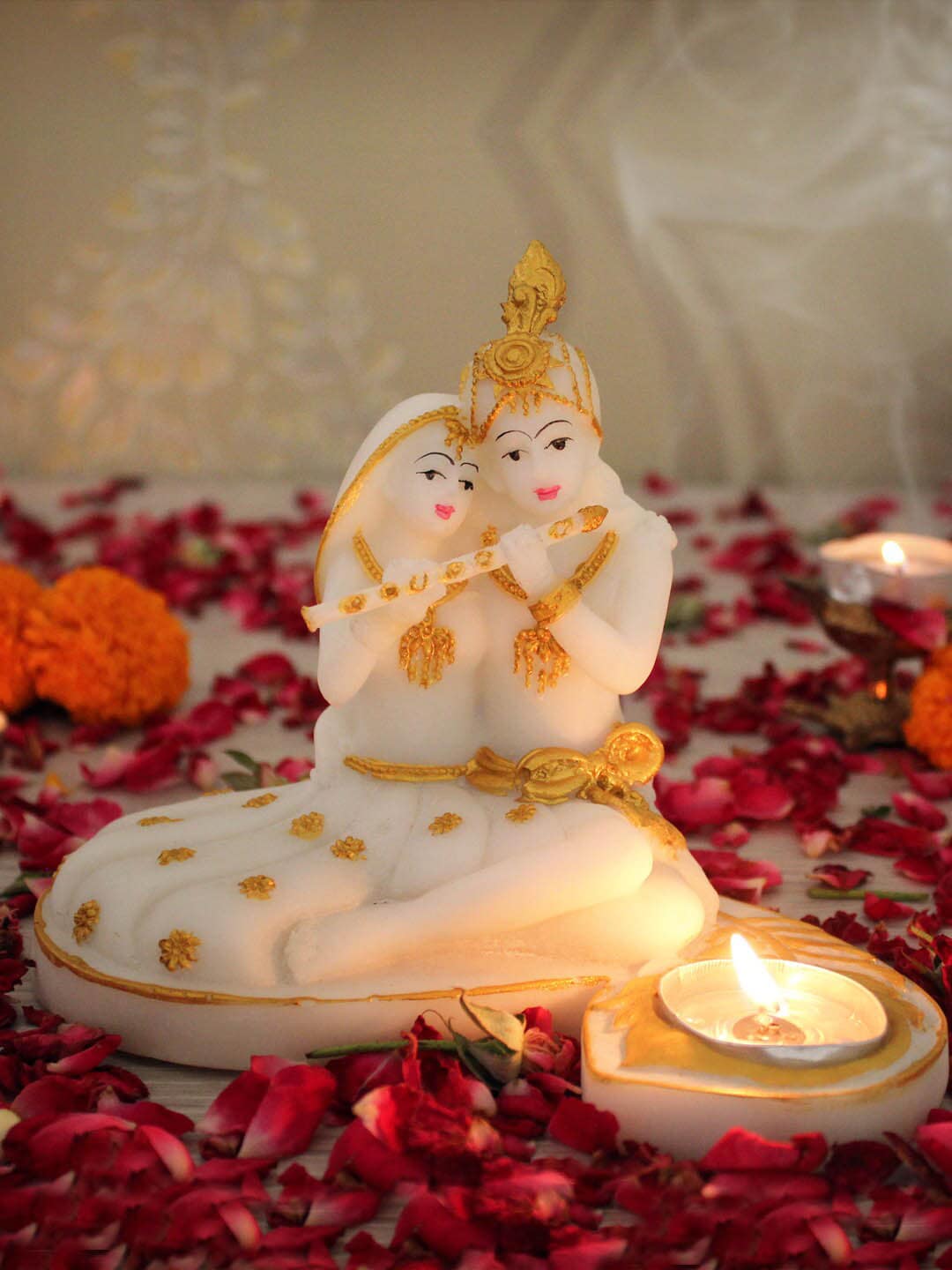 TIED RIBBONS Gold-Toned & White Radha Krishna Idol with Tealight Candle Holder Showpieces Price in India
