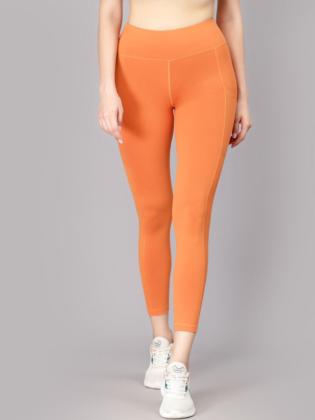 JUMP USA Women Orange Solid Rapid Dry Tights Price in India