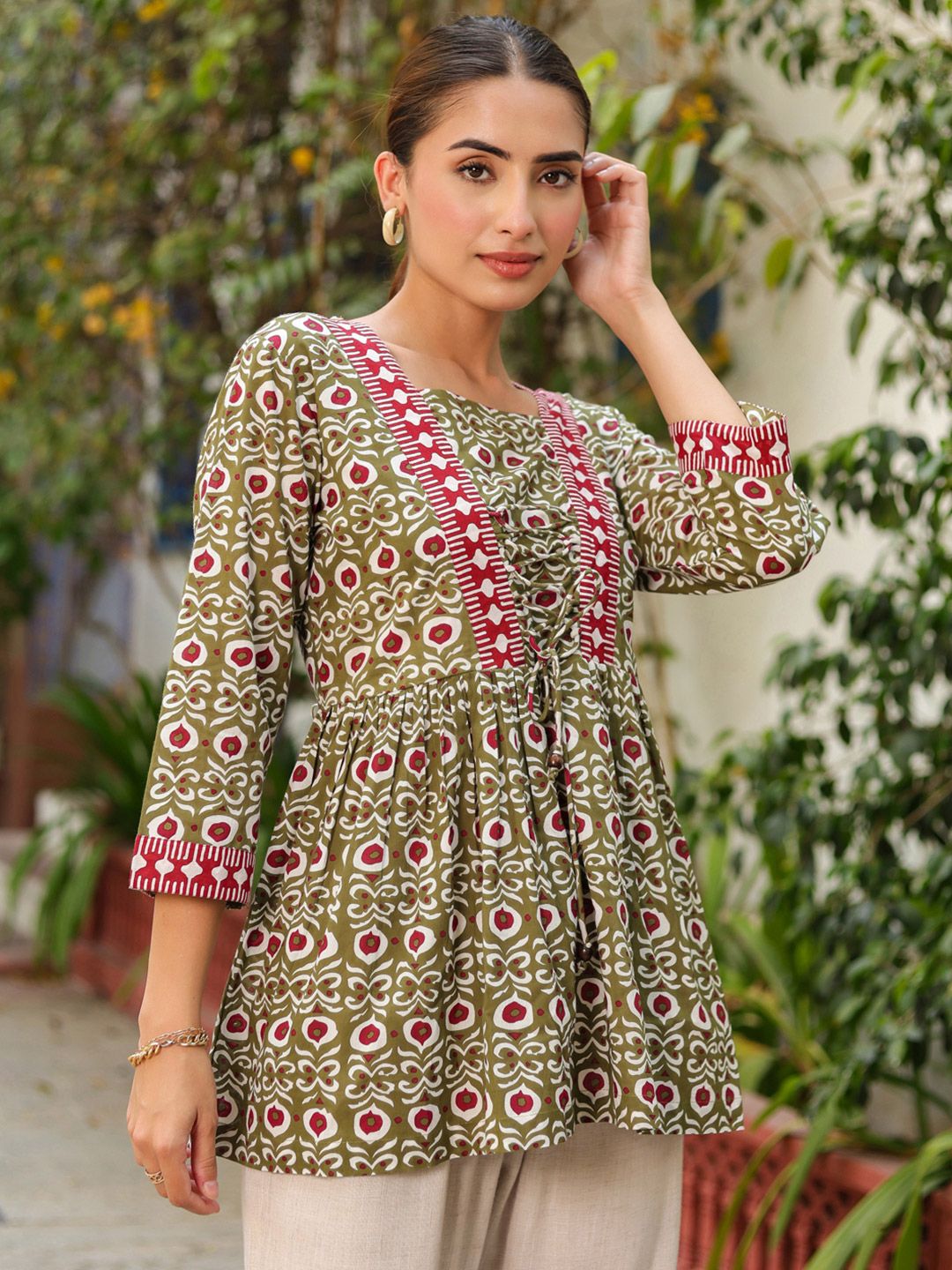 Buy Rain & Rainbow Floral Printed V-Neck Tie-Ups Peplum Cotton Top