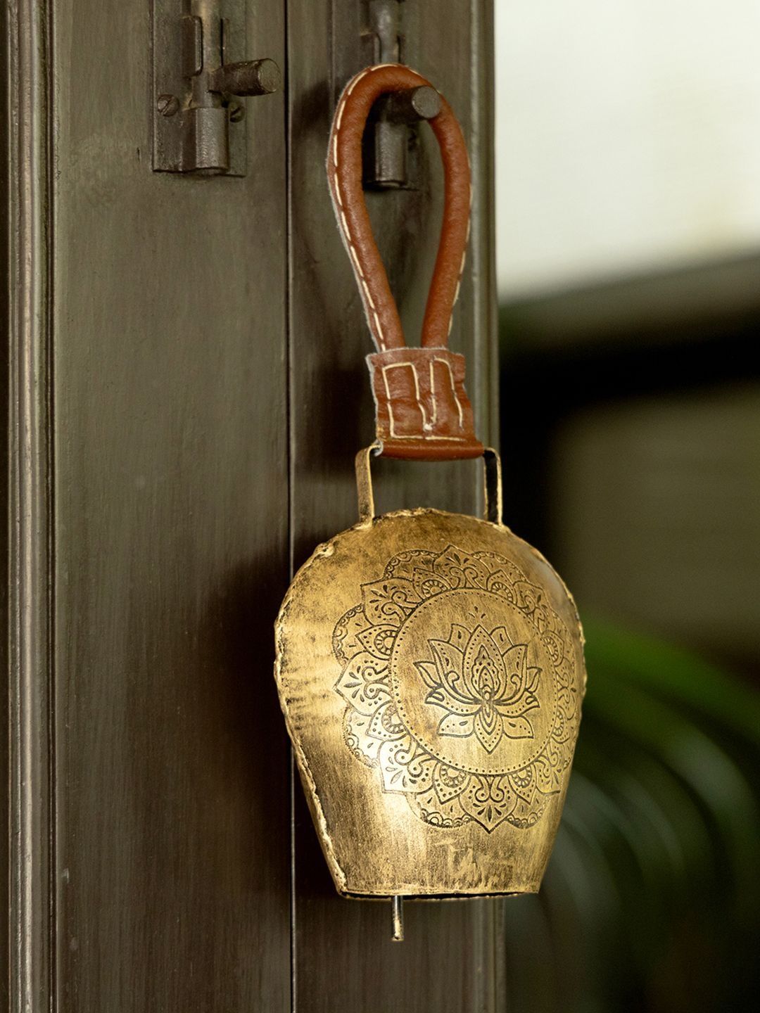 DULI Brown Cowbell With Embossed Lotus Design Wall Hanging