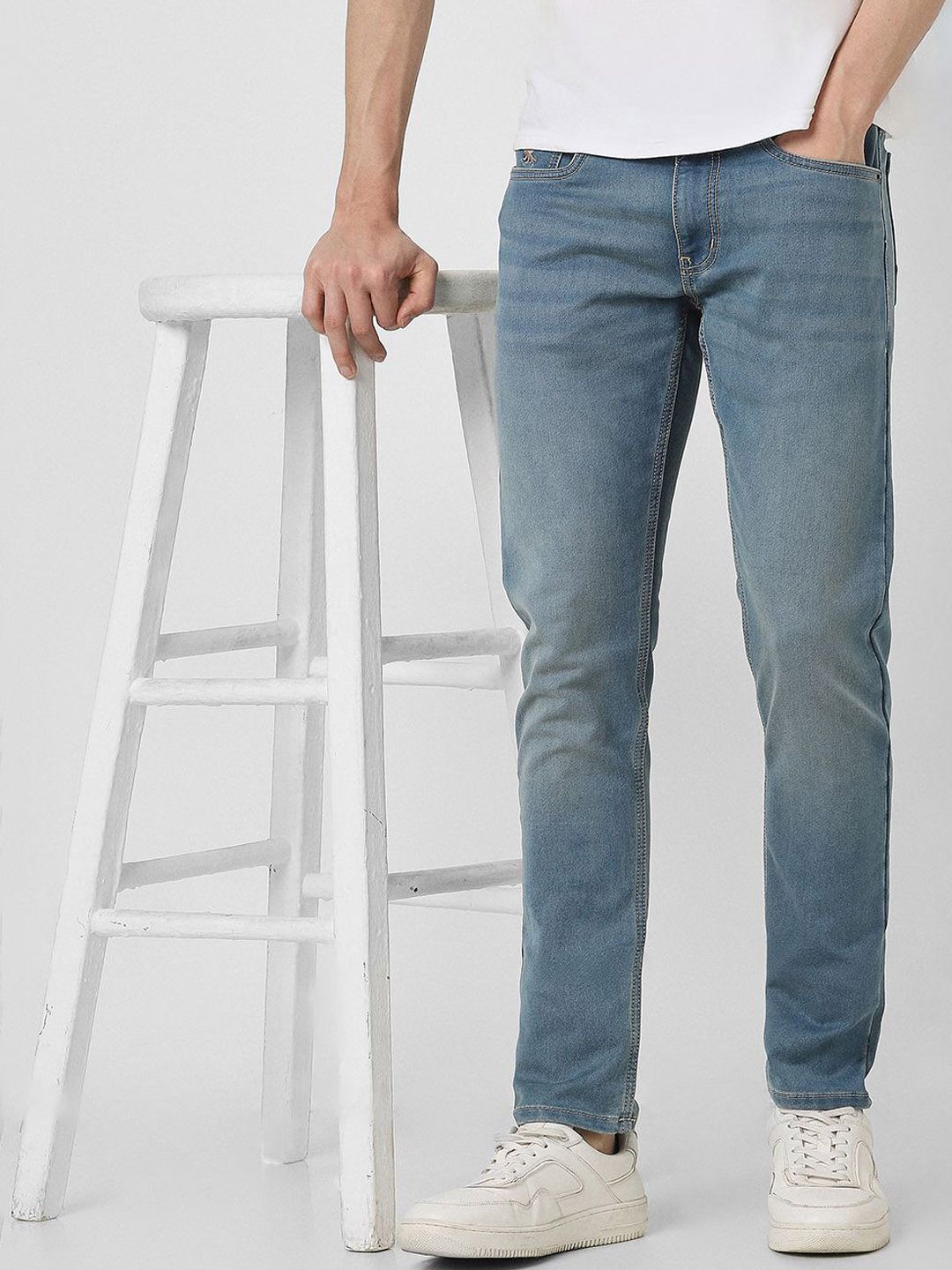 Peter England Casuals Men Slim Fit Low Distress Light Fade Jeans