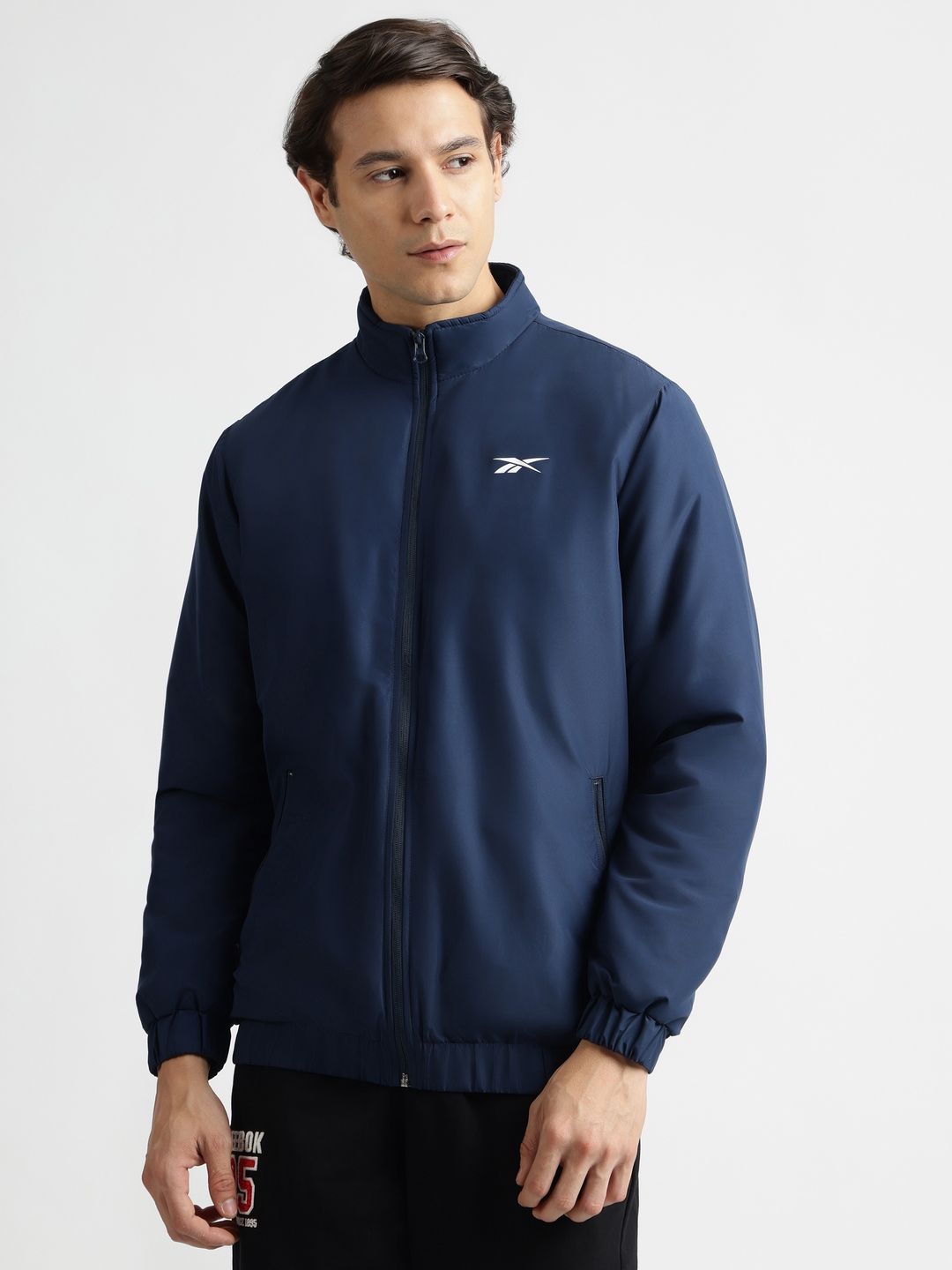 Reebok Men Mock Collar Solid Casual Bomber Jacket