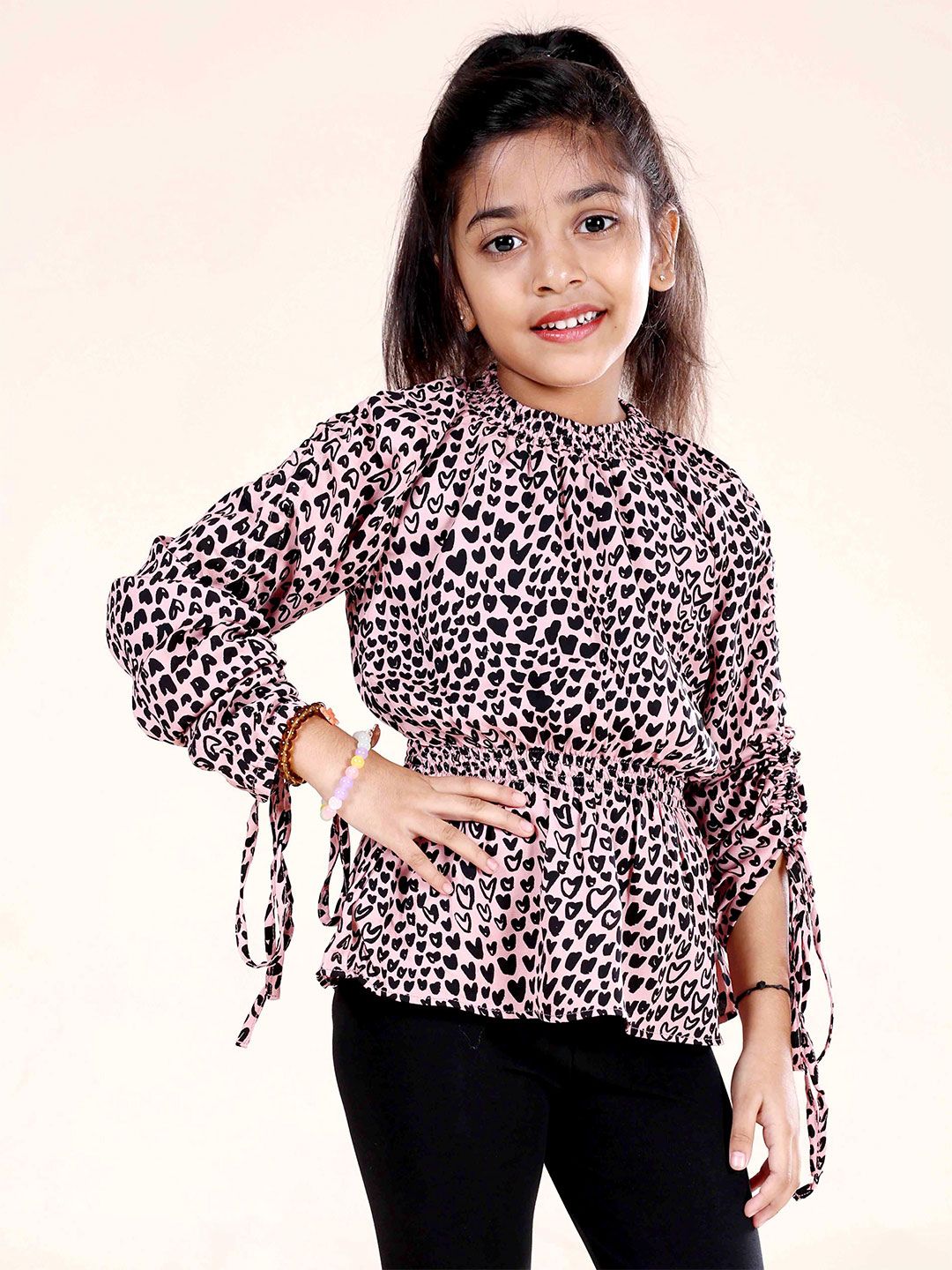 KiddoPanti Girls Printed Puff Sleeve Smocked Peplum Top