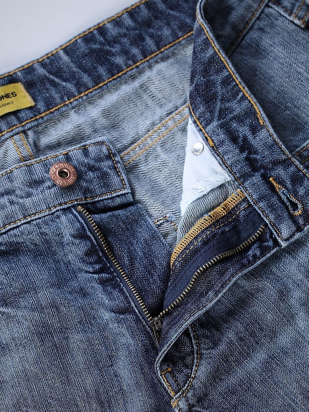 Tapered Fit Low-Rise Mildly Distressed Light Fade Jeans