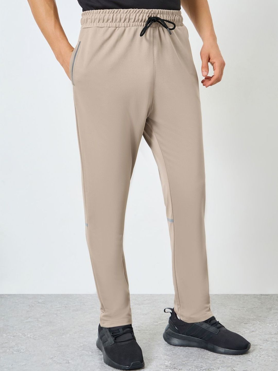 Styli Men Reflective Print Solid Slim Fit Mid-Rise Track Pants