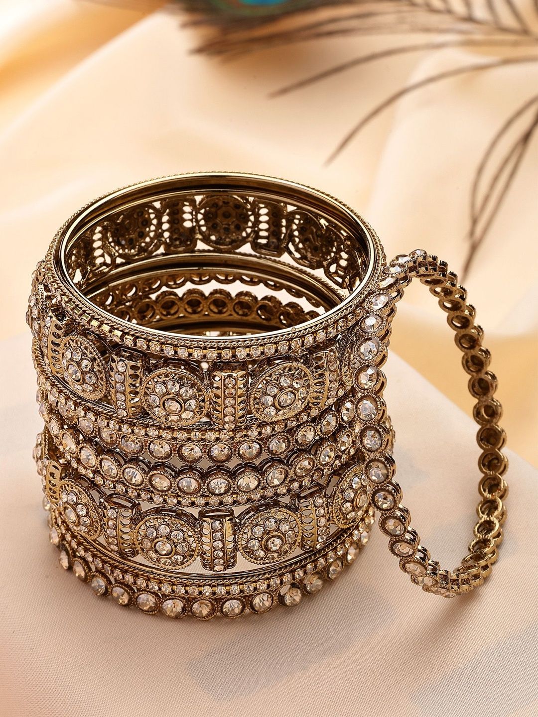 KARATCART Set Of 10 Gold-Plated Kundan Stone-Studded Bangles deal from myntra