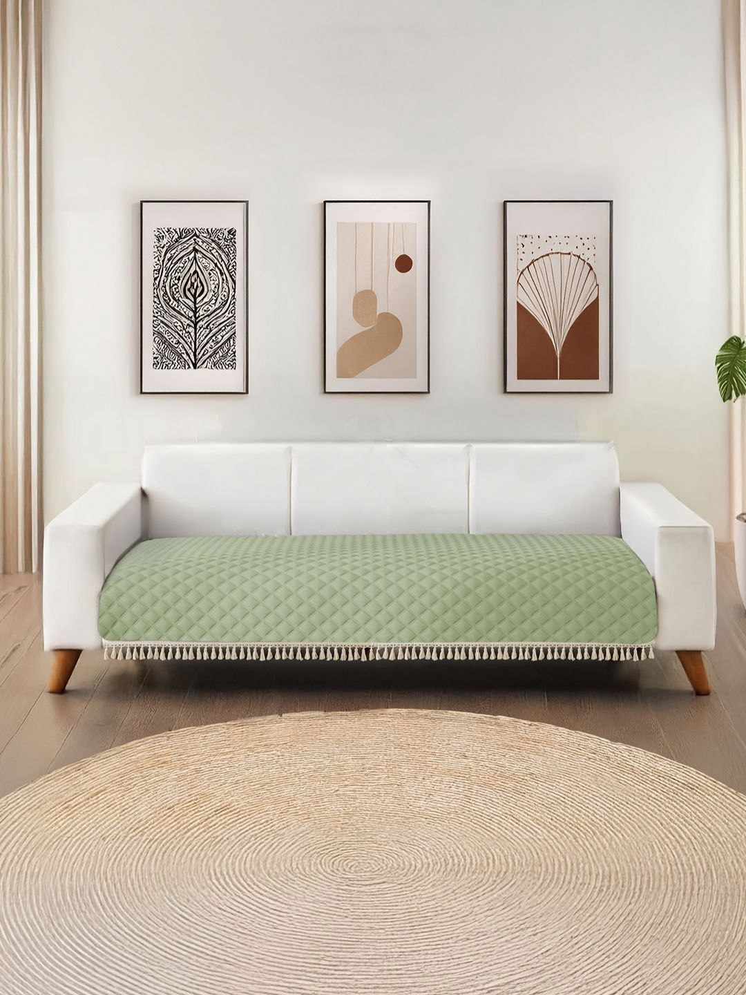 URBAN SPACE Green Quilted Microfiber 2 Seater Sofa Cover with Tassels