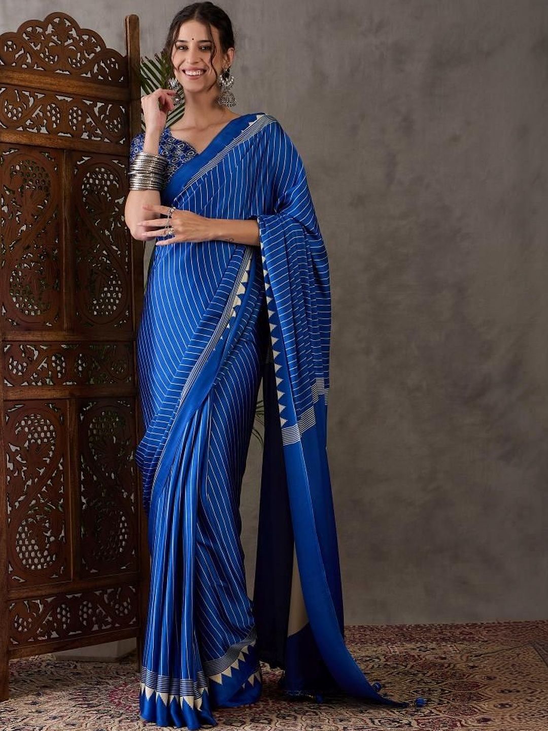 ZYVIRA Blue Ajrakh Printed Saree With Tassles And Unstitched Blouse