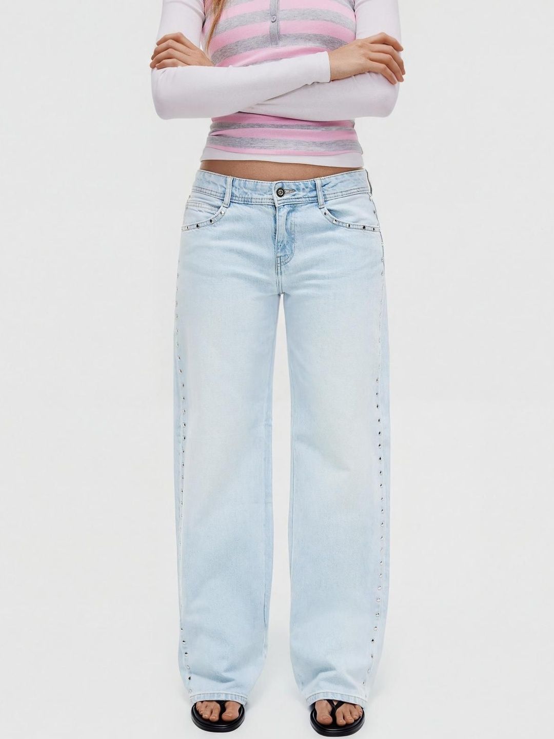 Low-rise baggy studded jeans