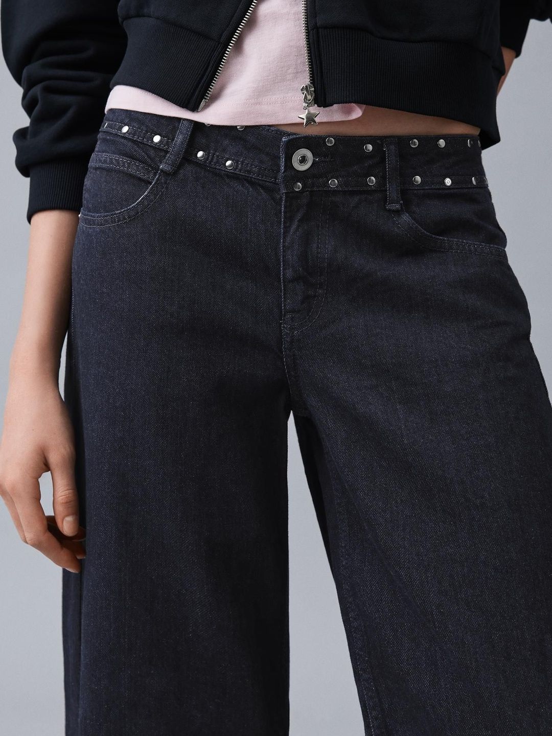 Low-rise baggy studded jeans