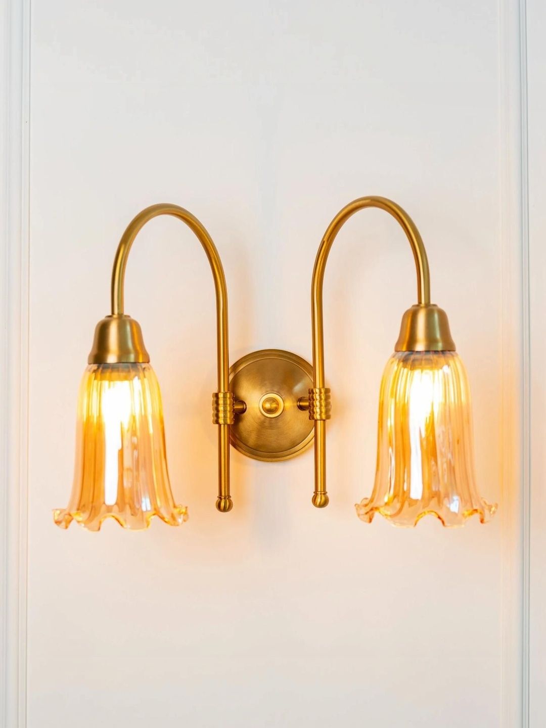 Divine Trends Double Hockey Brass Antique Finish Wall Lamp with Golden Glass