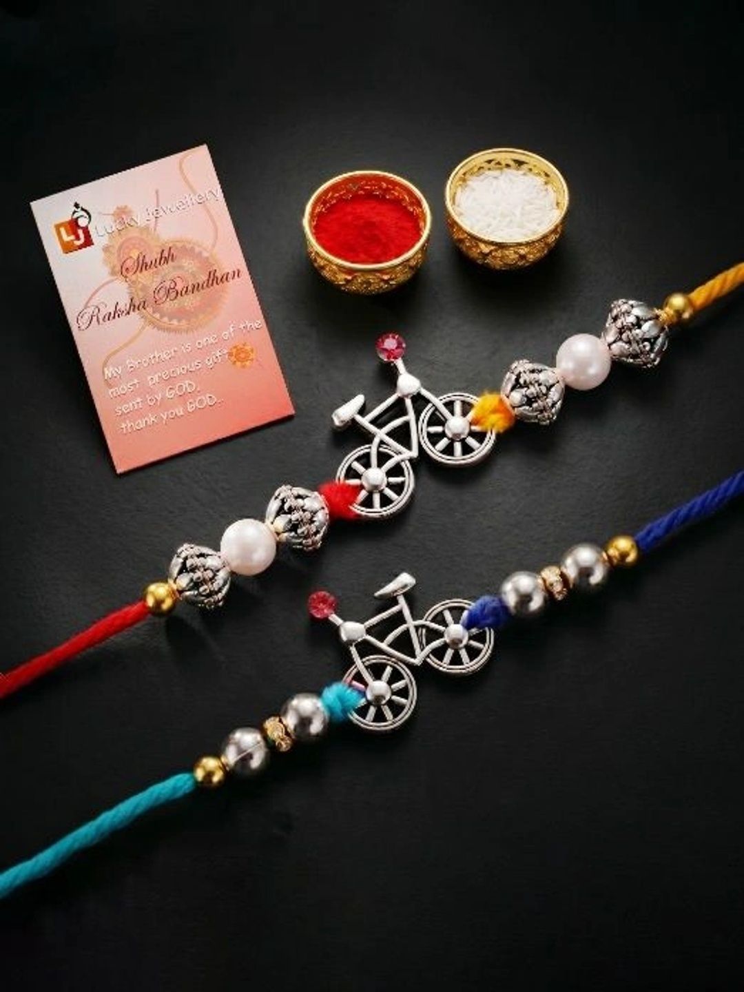 LUCKY JEWELLERY LUCKY JEWELLERY Set of 2 Silver Bicycle White & Metallic Beads Rakhi, Roli Chawal & Card