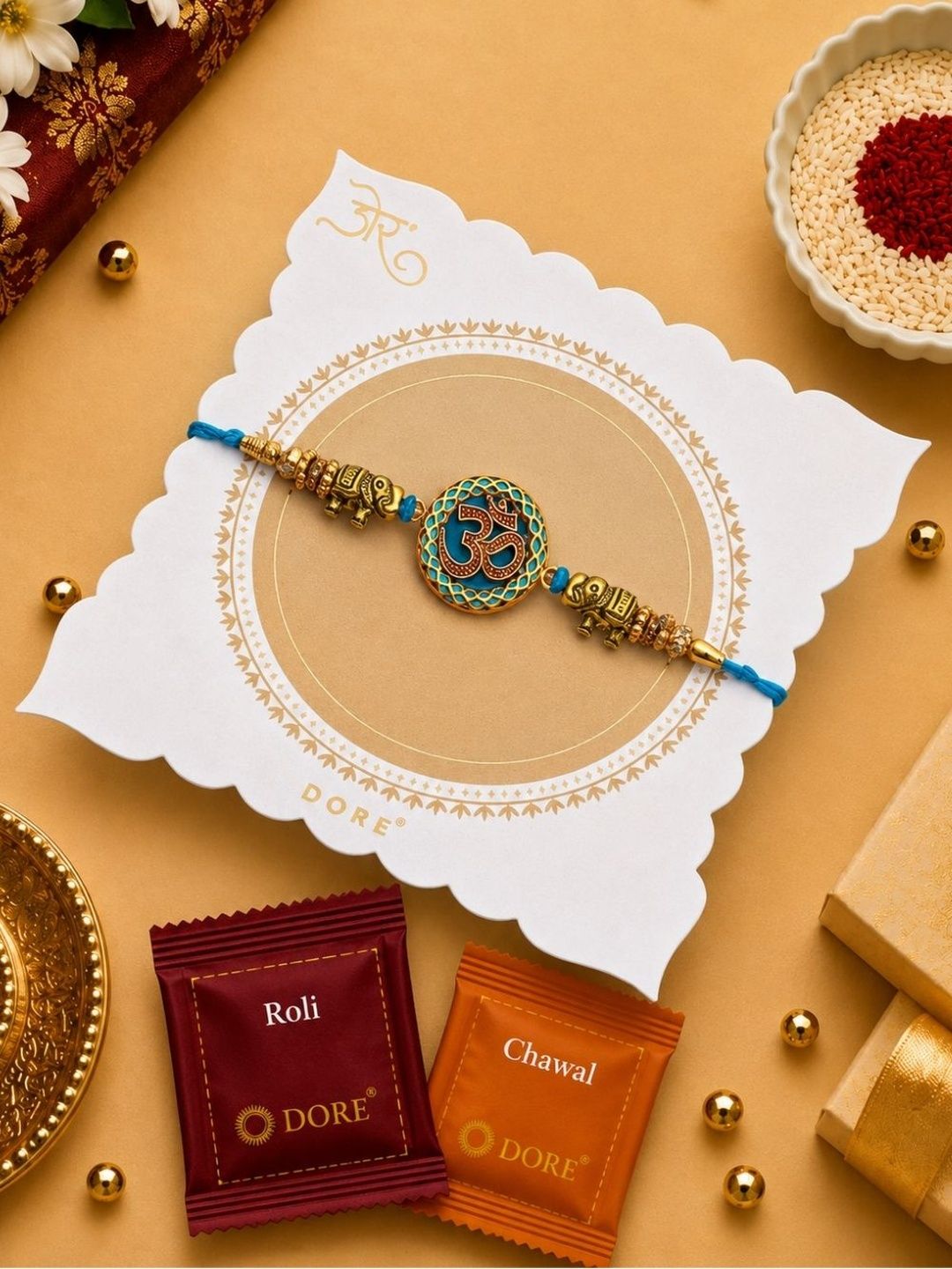 Dore Golden Colored Om & Elephant Turquoise Beaded Rakhi with Roli Chawal
