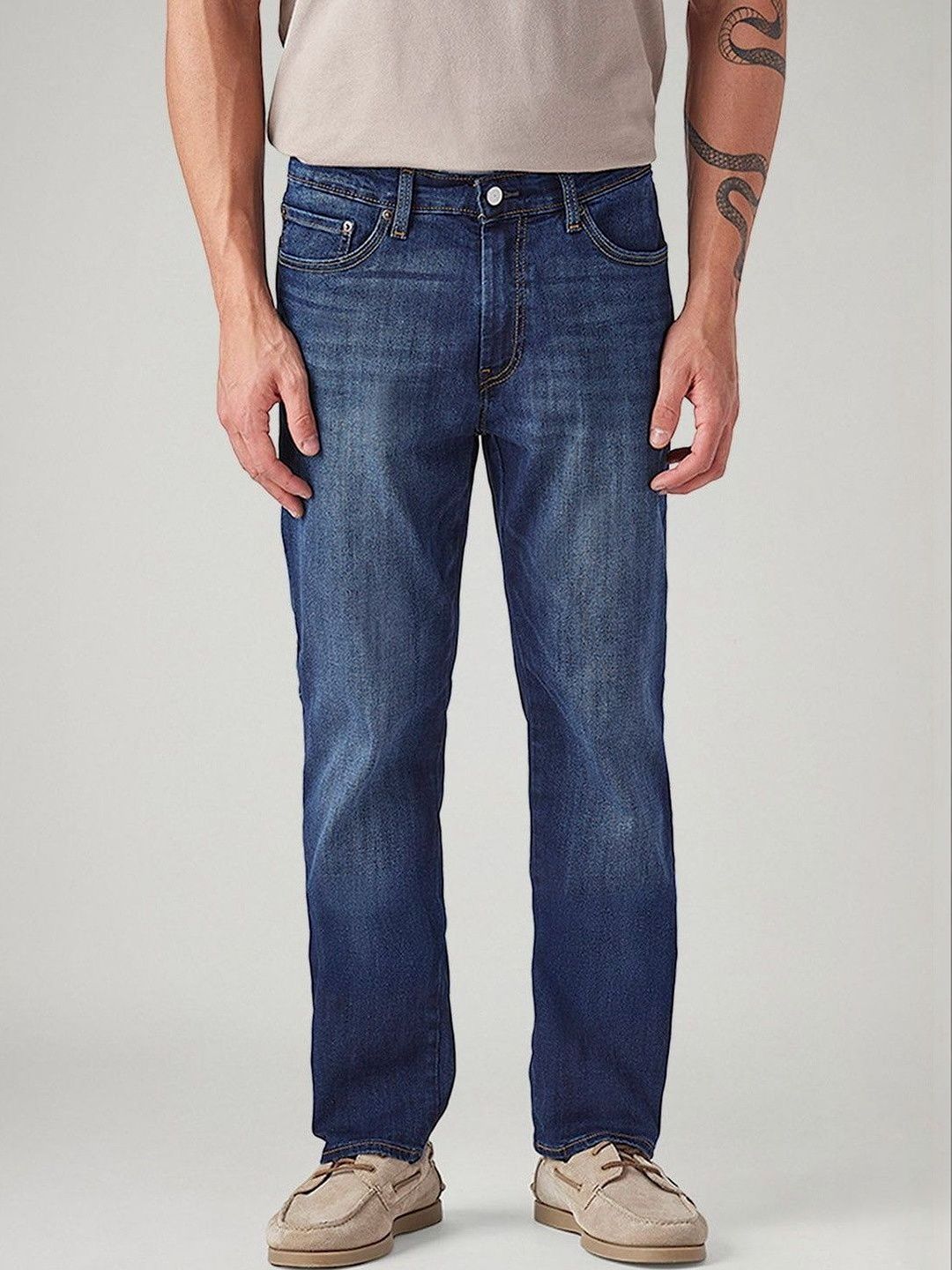 Levis Men Classic Tapered Fit Mid-Rise Light Fade Stretchable Jeans deal from myntra